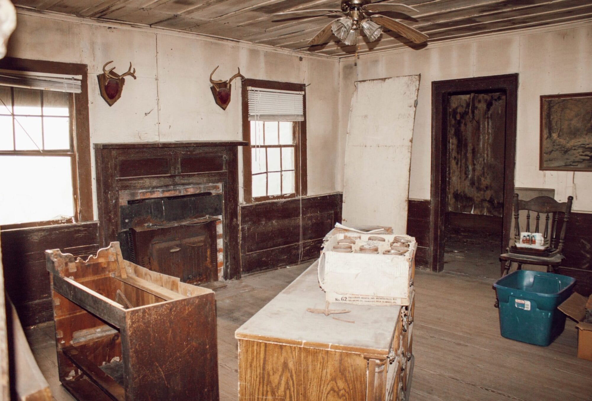 historic home living room with fireplace and wood floors