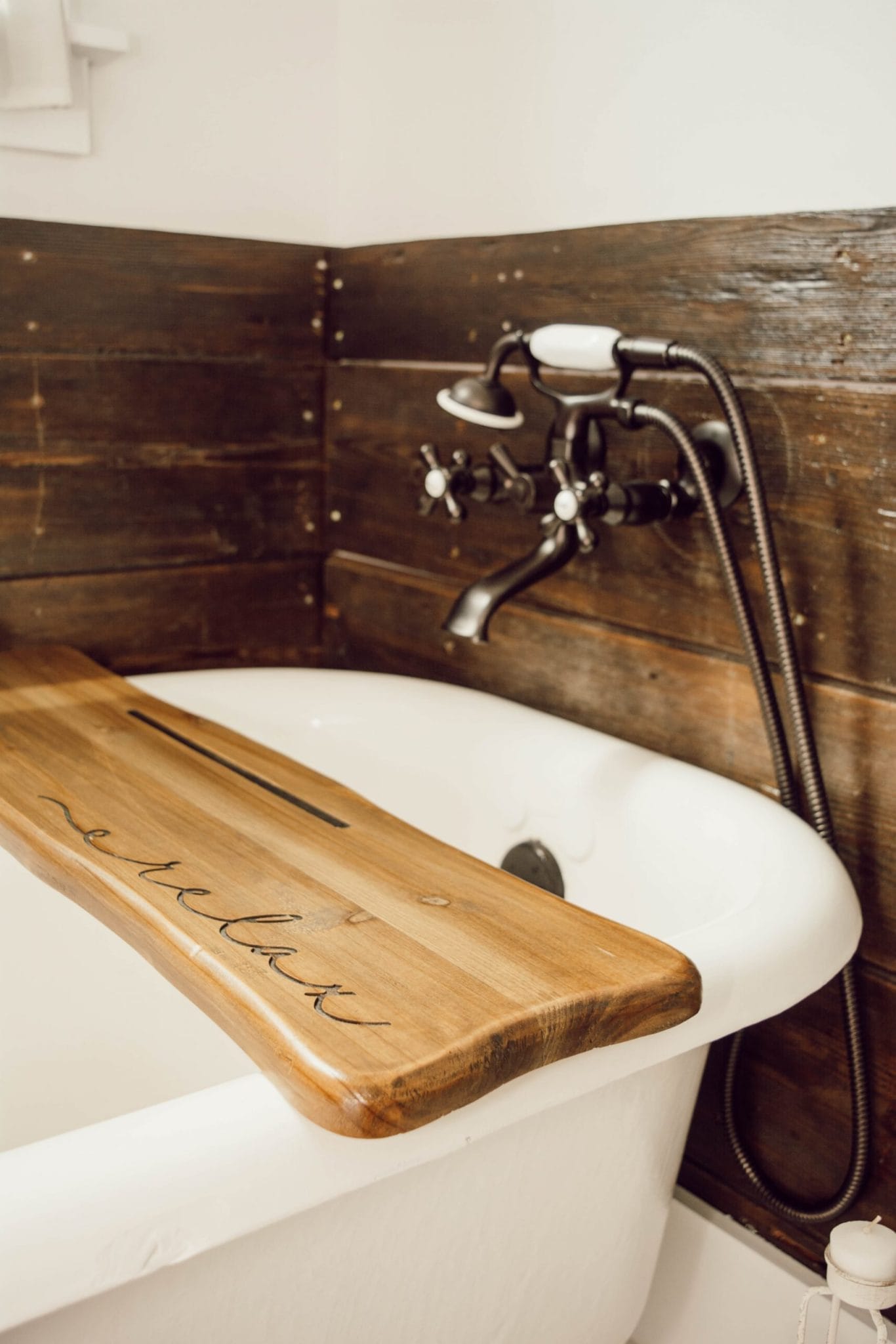 cast iron tub with reclaimed wood surround