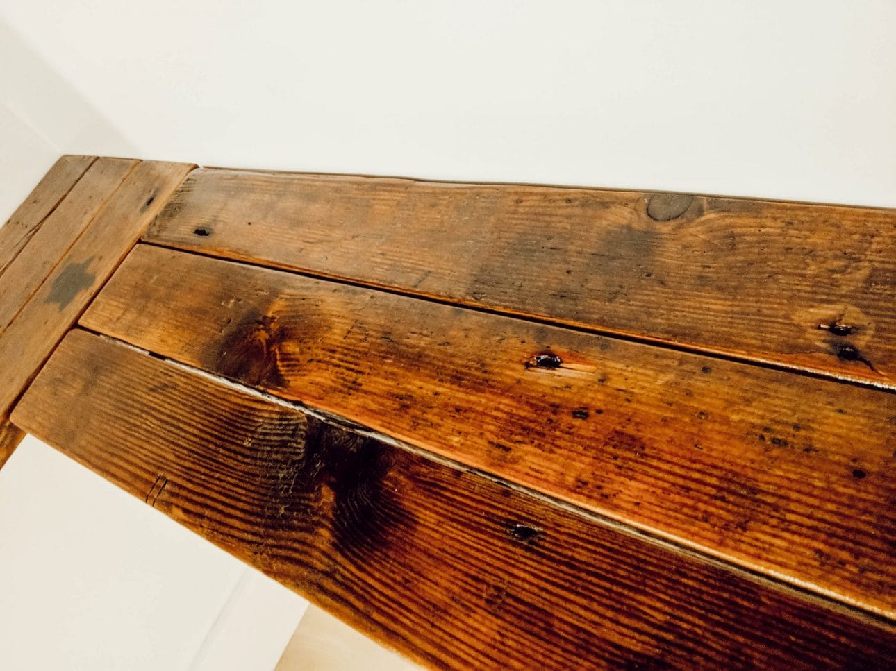 wood flooring turned into farmhouse style linen closet shelves