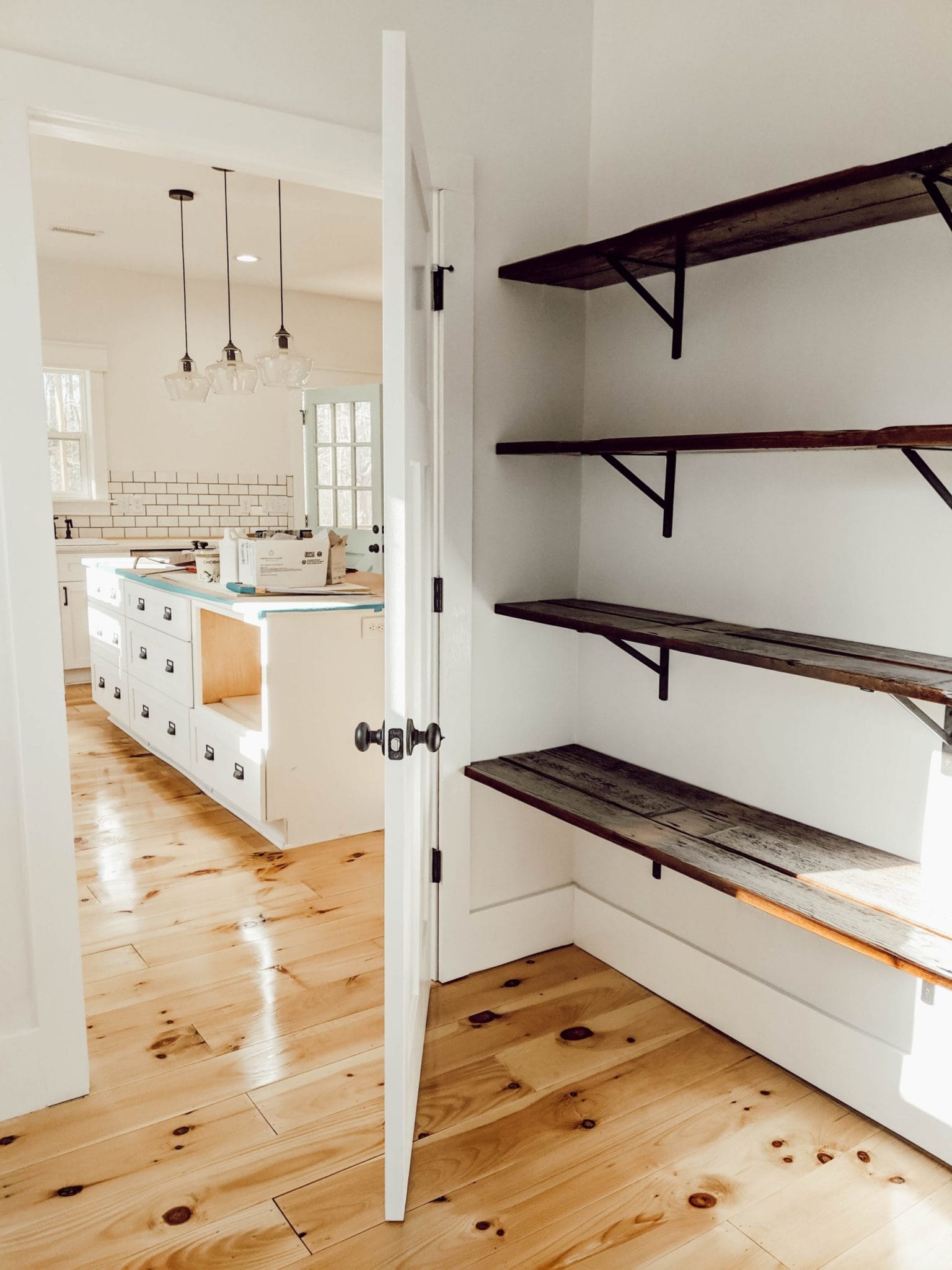 wood flooring turned into farmhouse style pantry shelves