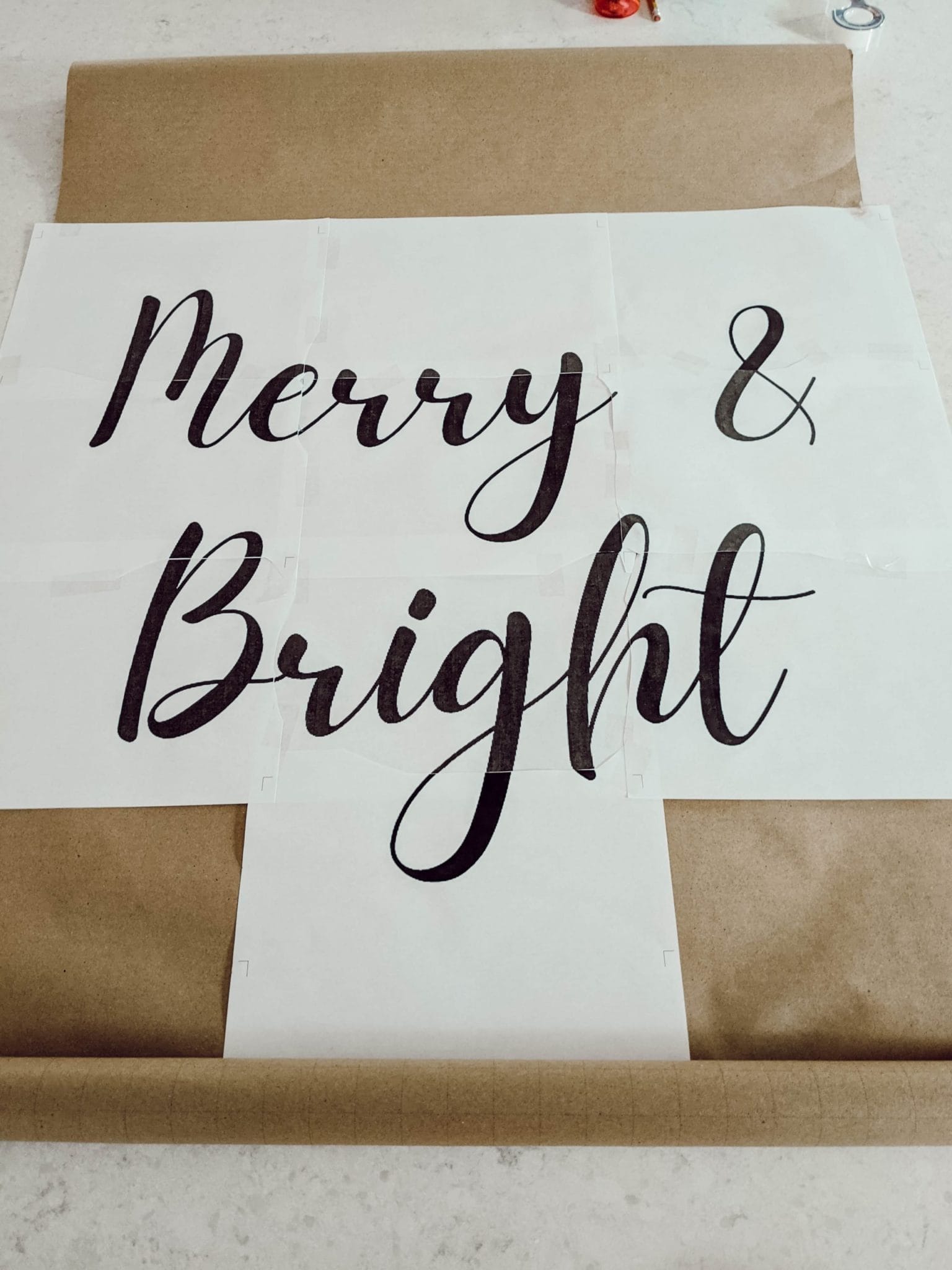diy Christmas scroll sign that reads merry and bright