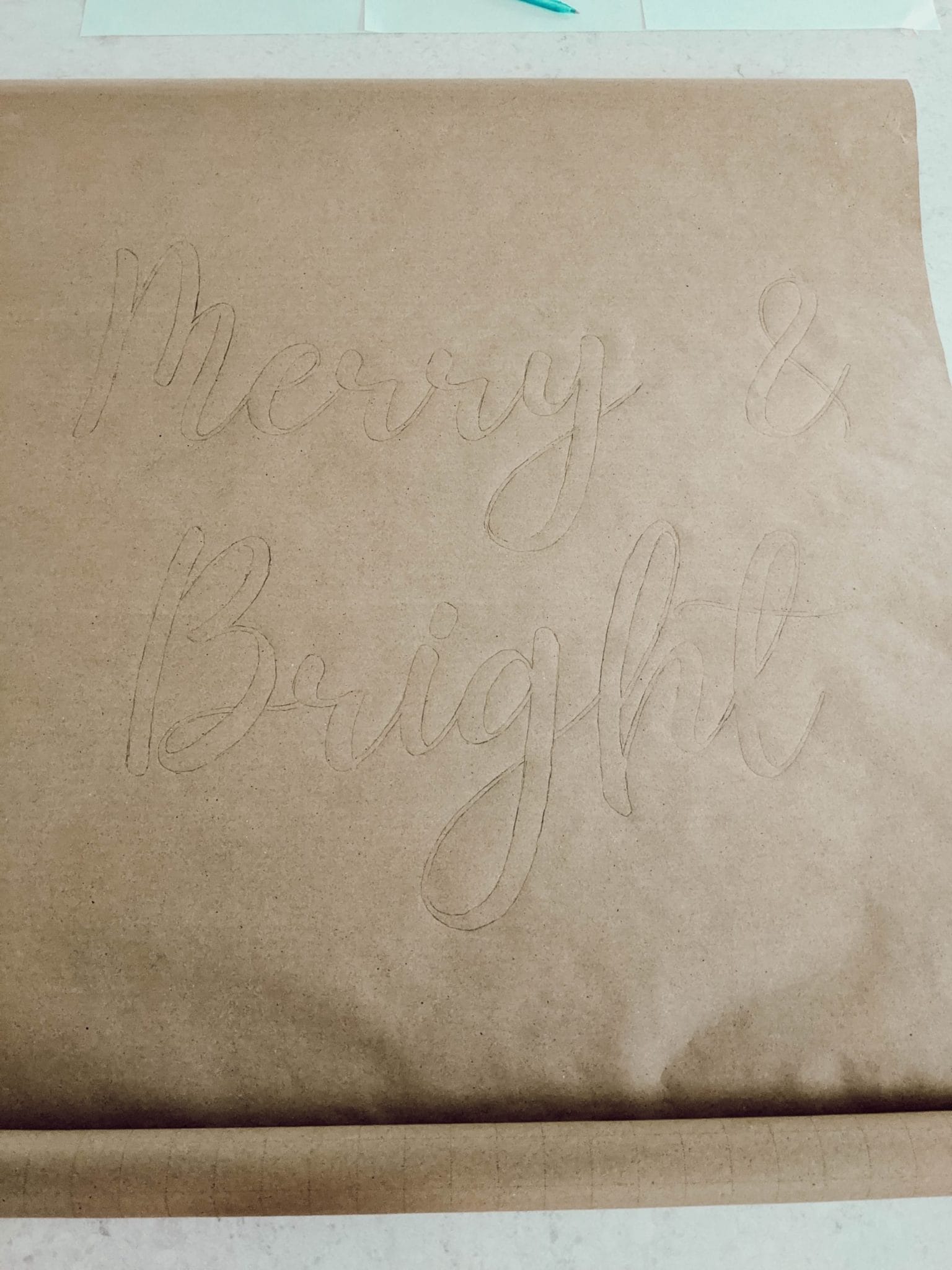 outline in pencil on DIY farmhouse scroll sign