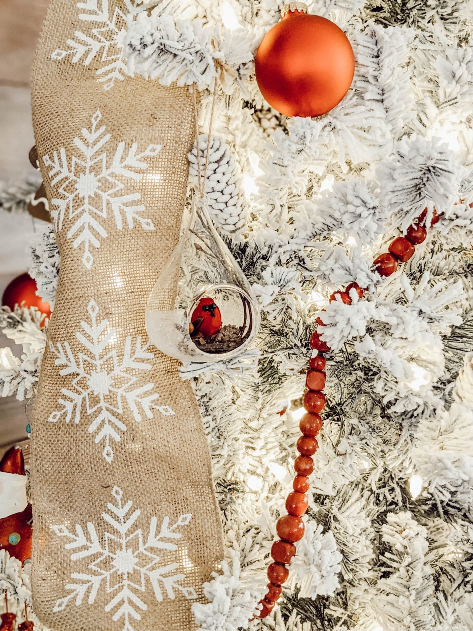 red garland and burlap ribbon for classic themed tree