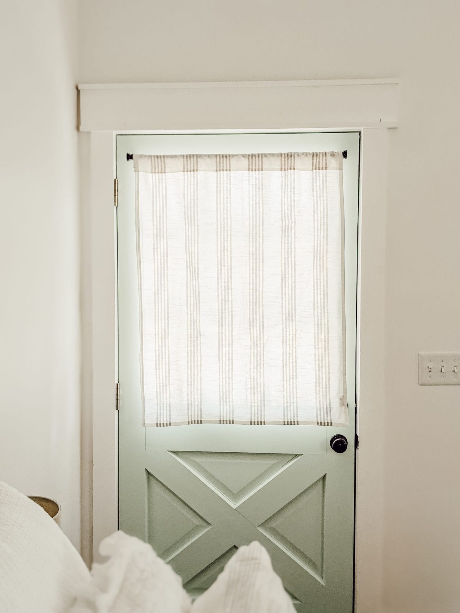 farmhouse window treatment for blue exterior door