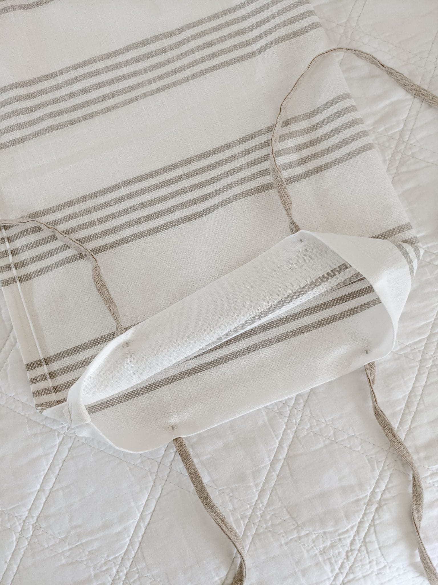 ties pinned to the hem