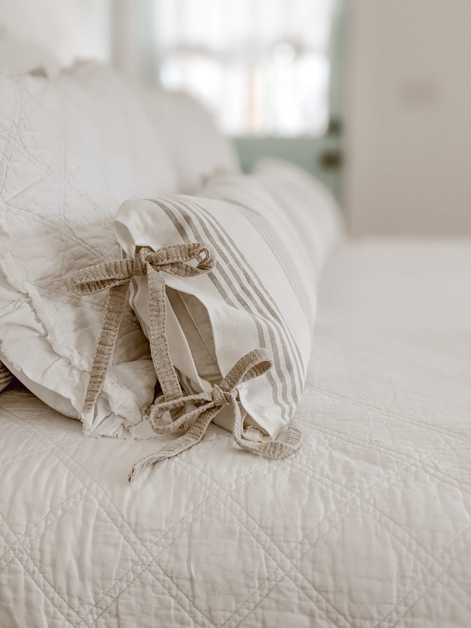 tie closures on a farmhouse style lumbar pillow