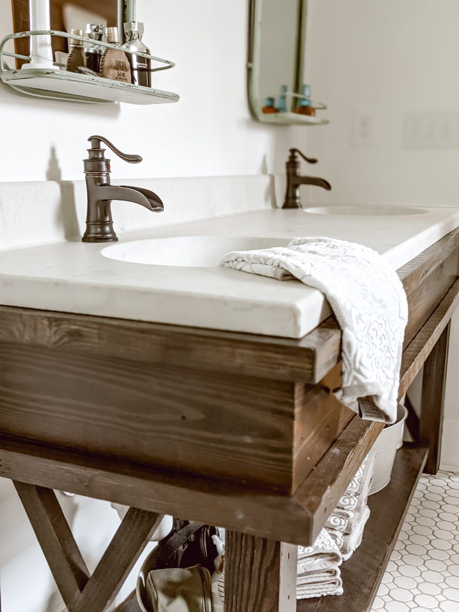 Custom farmhouse vanity with wood base and marble countertops