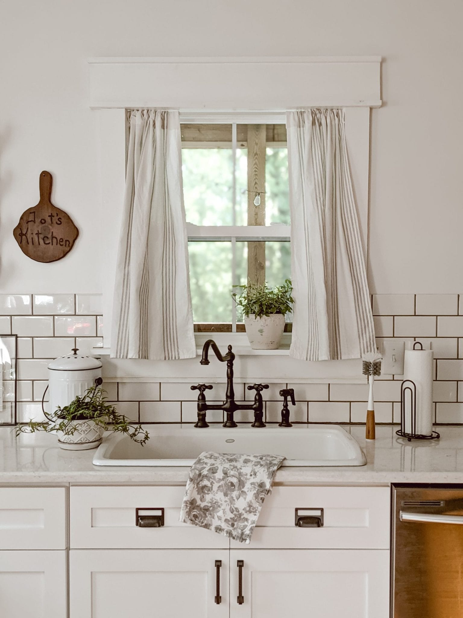 white farmhouse kitchen with countertop compost pail
