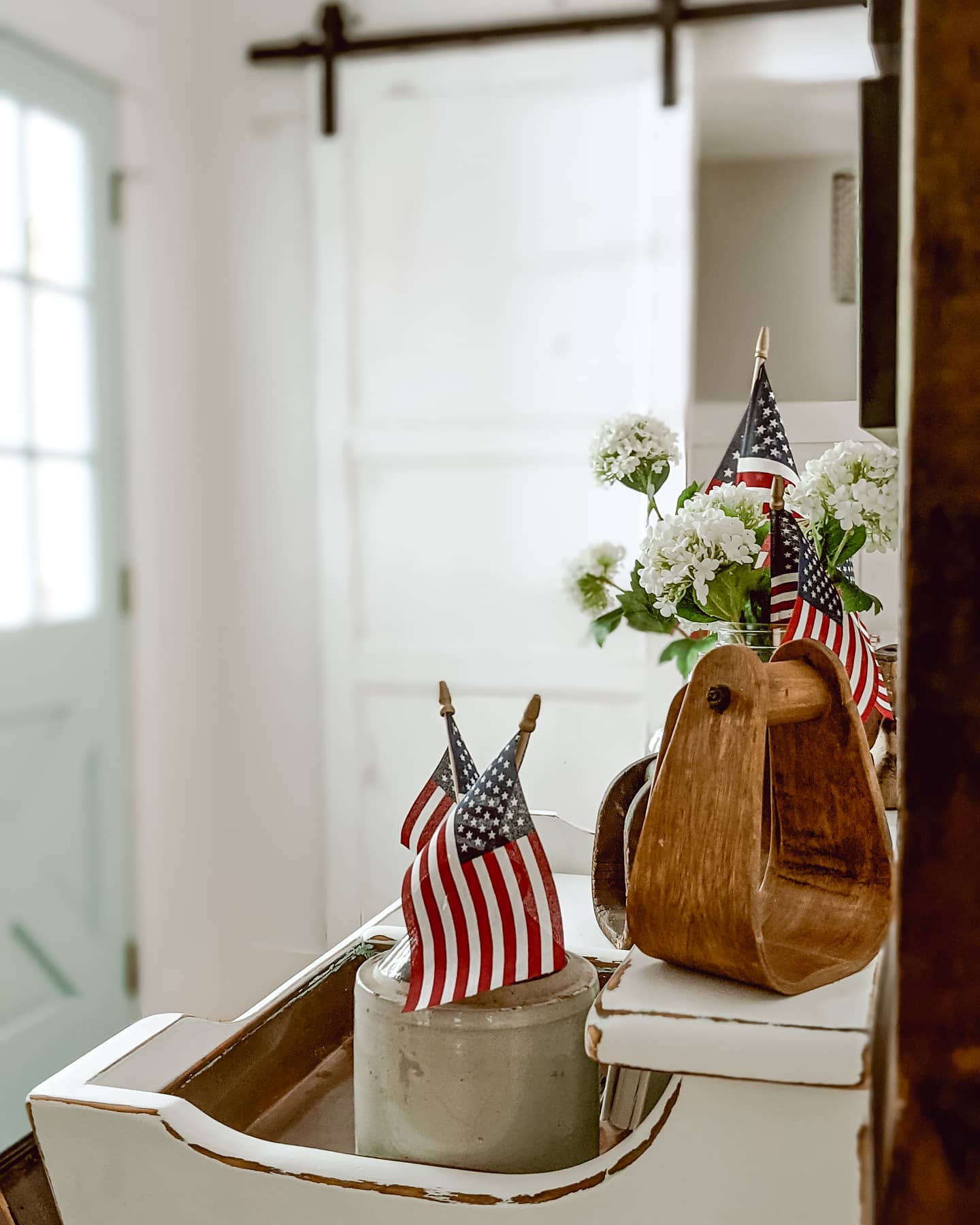 entry way decor for memorial day using mini flags and vintage wood accents