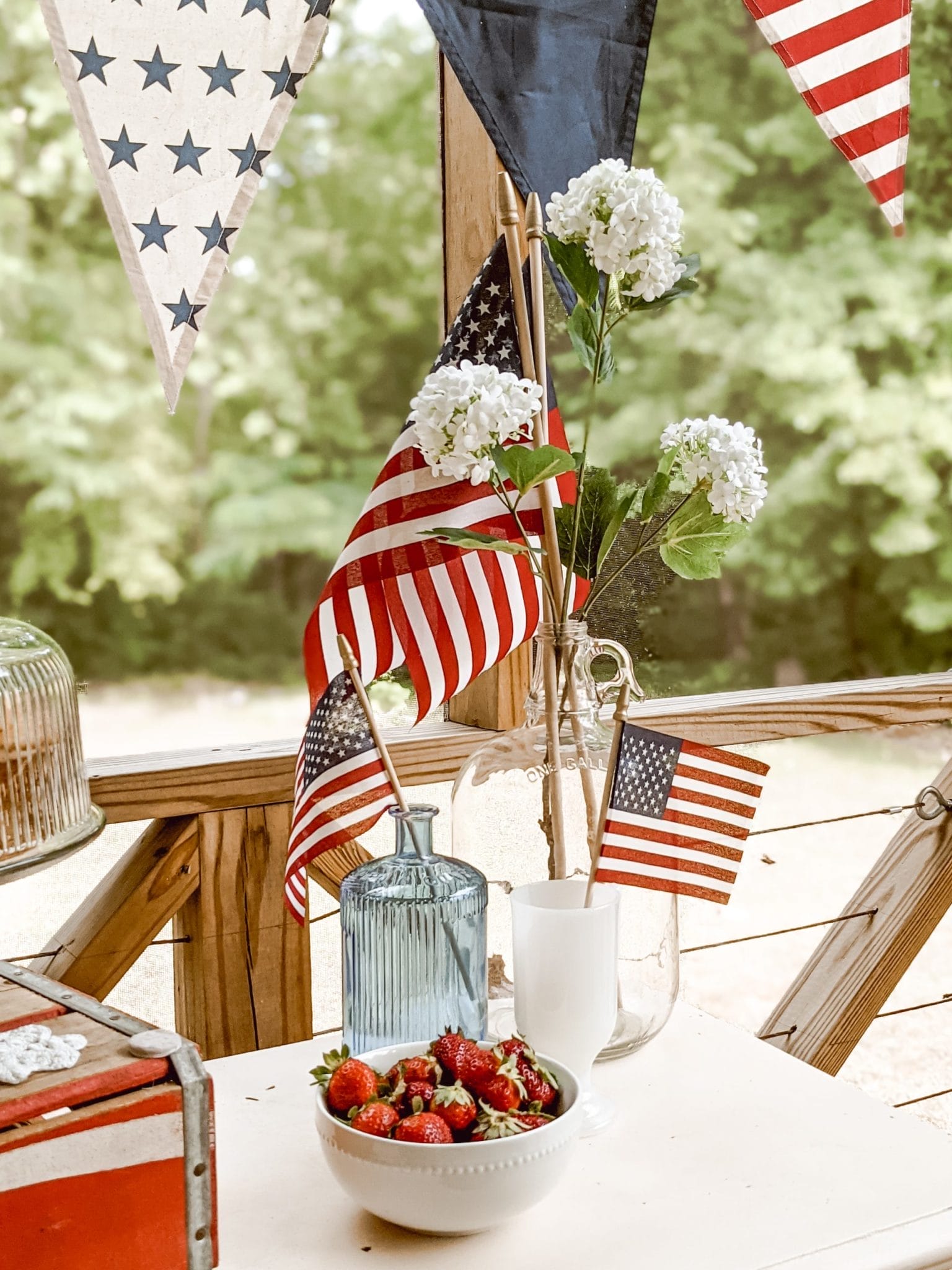 vintage glassware, mini flags, and white flowers