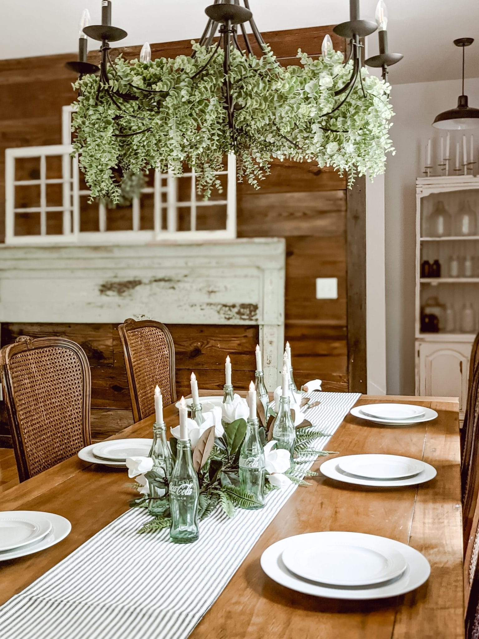 chippy antique mantlepiece on wall of reclaimed shiplap
