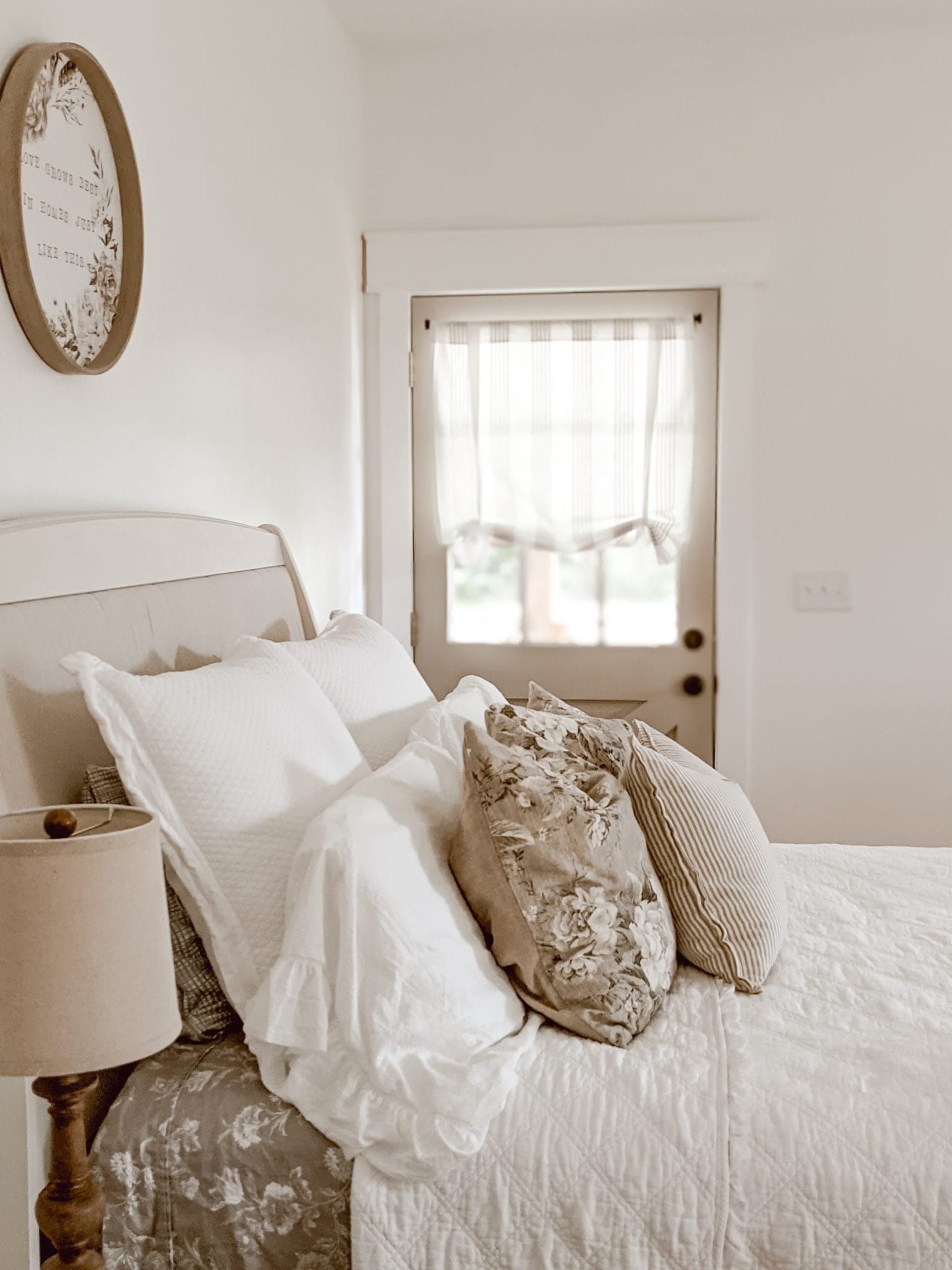 white cottage farmhouse bedroom with floral accents