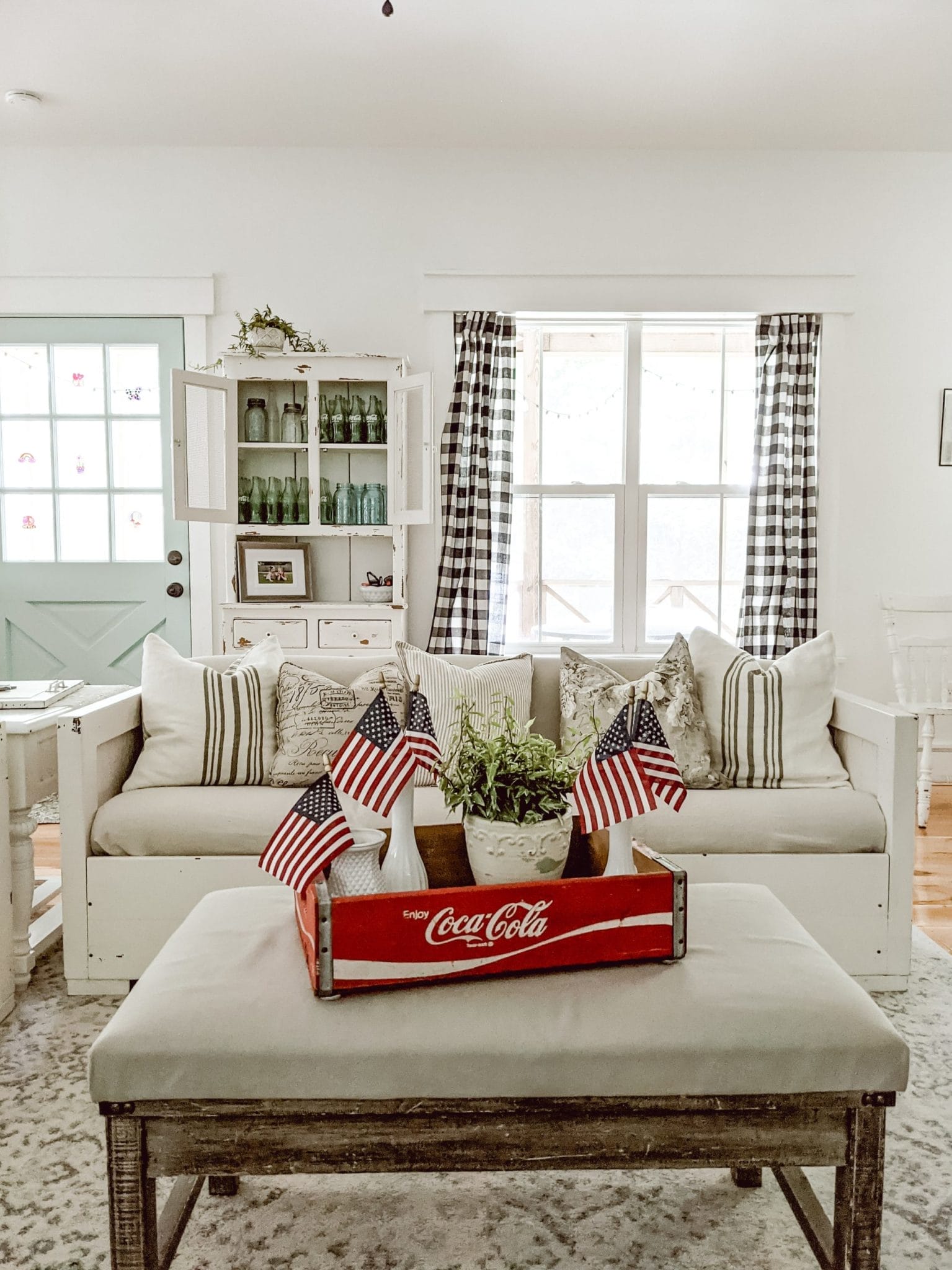 white cottage farmhouse living room with vintage fourth of july coffee table decor