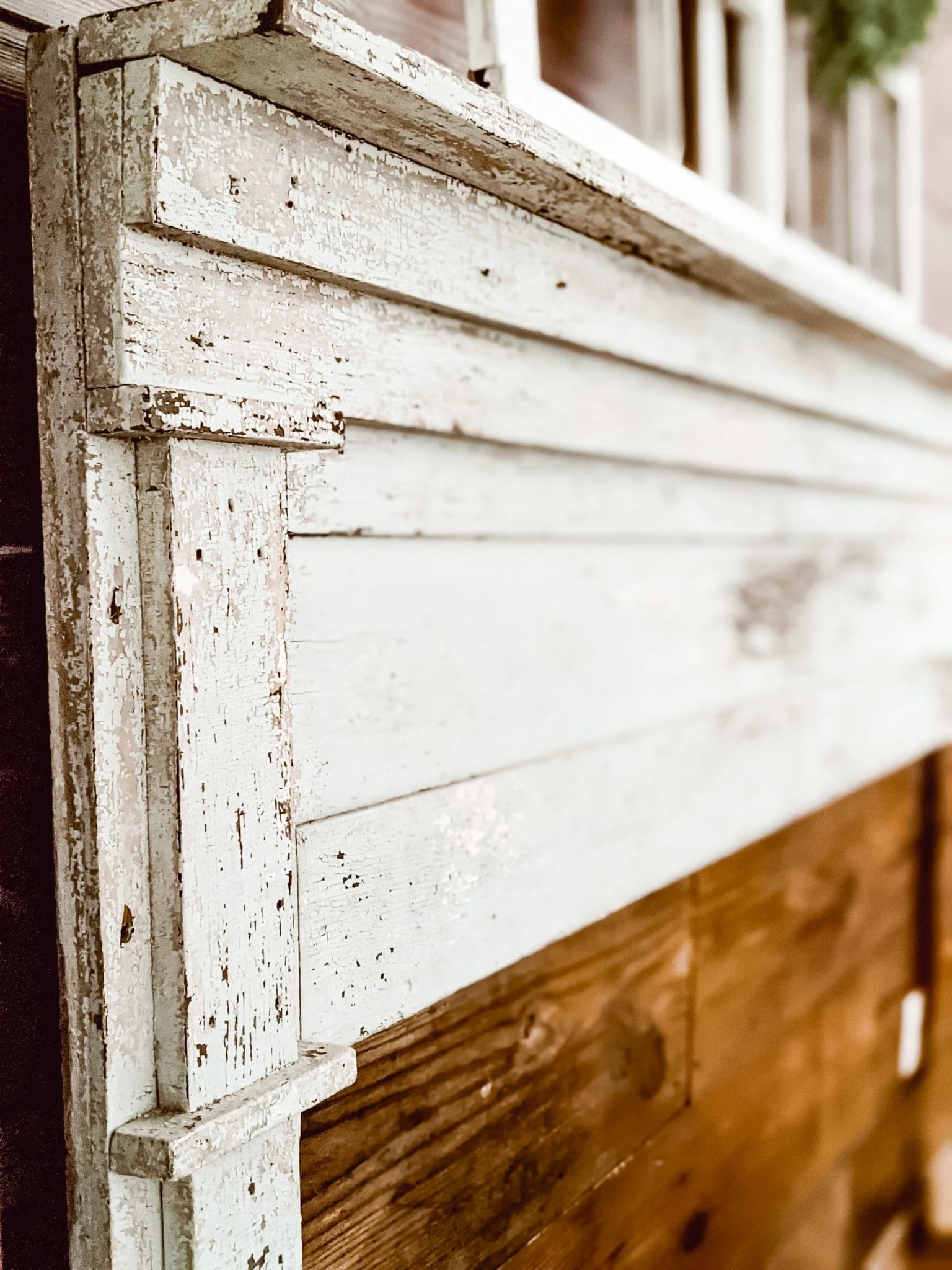 farmhouse fireplace project with chippy antique mantlepiece on wall of reclaimed shiplap