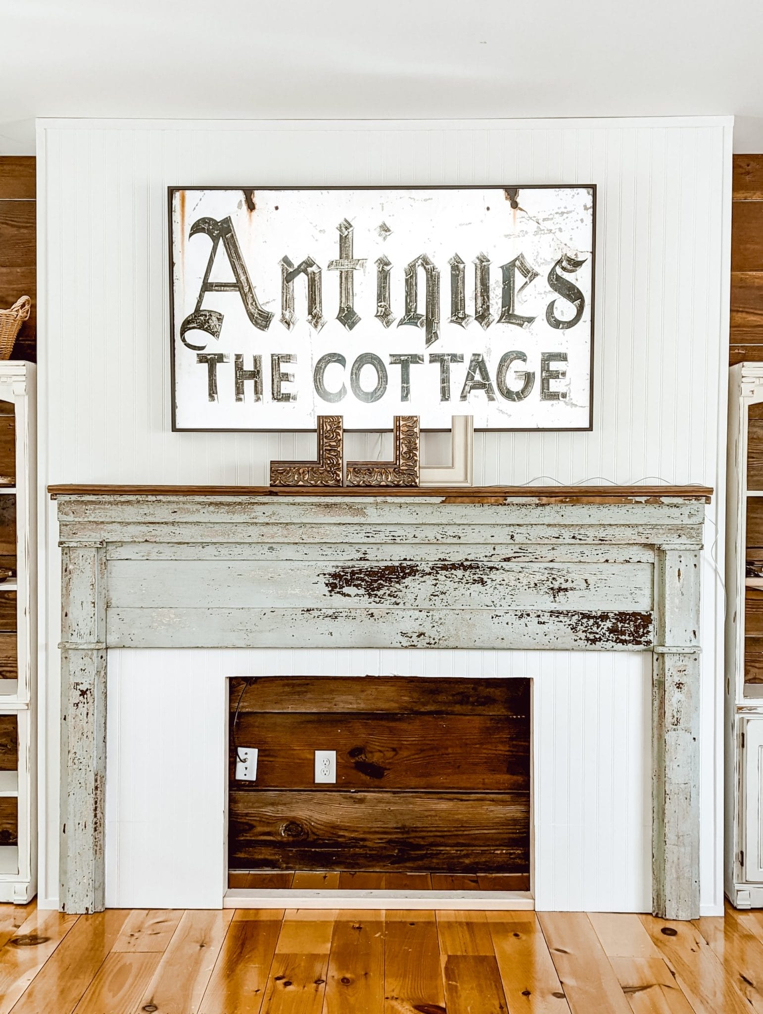 Samsung Frame TV on beadboard wall above fireplace