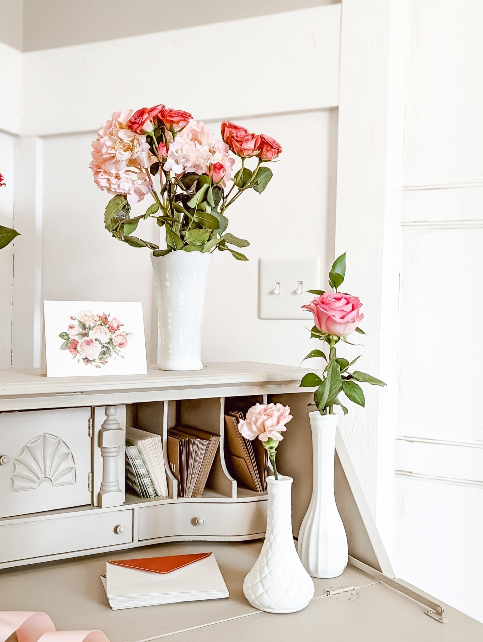 milk glass bud vases and pink roses