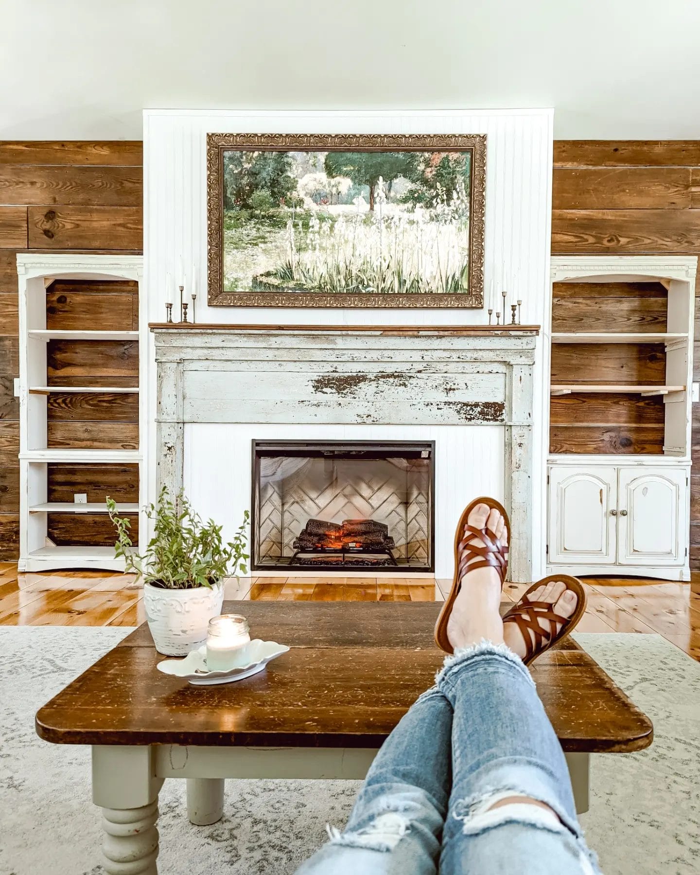 looking at the progress on our DIY fireplace project after installing the TV and the electric insert