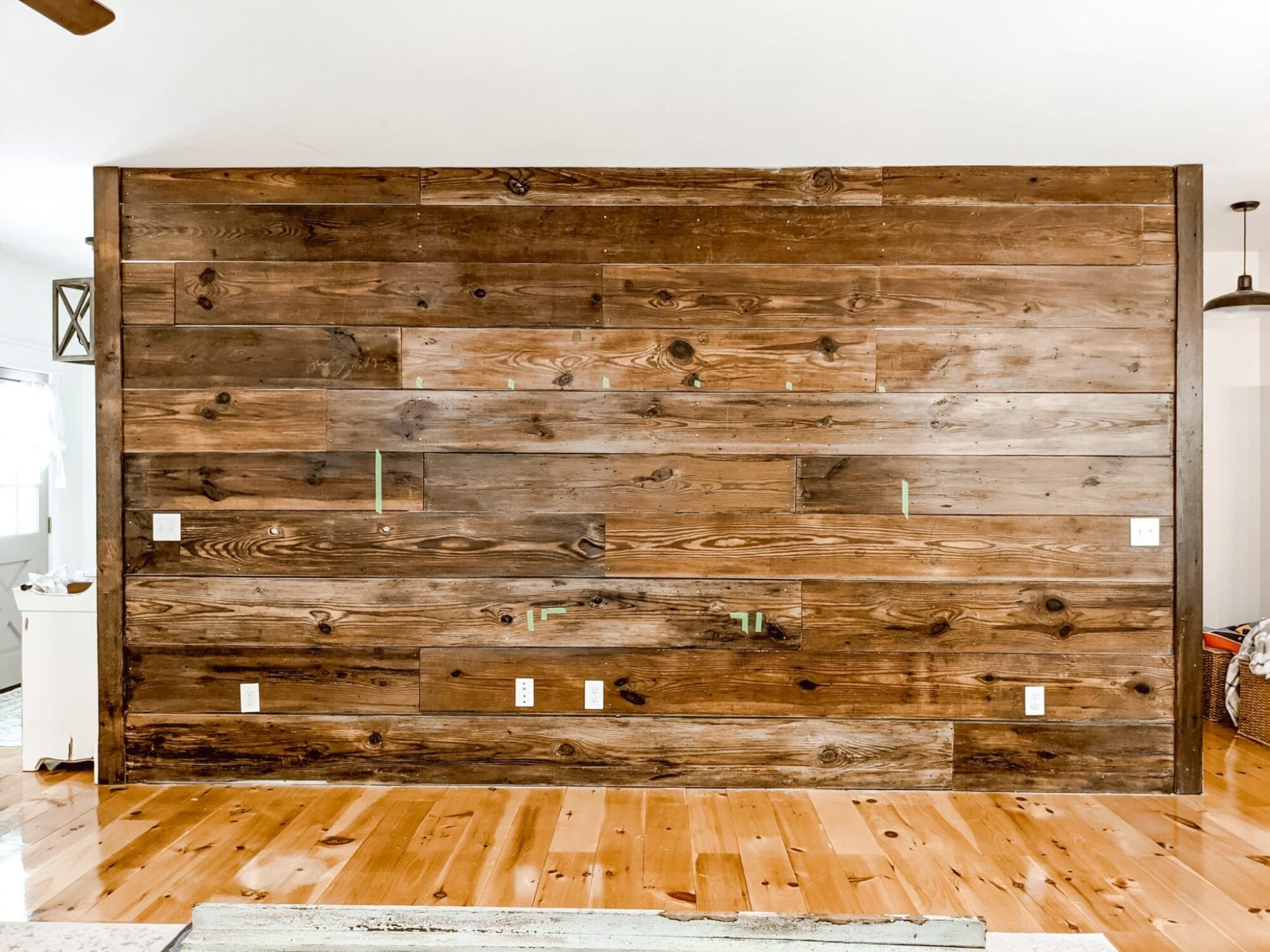 wall of dark stained reclaimed shiplap