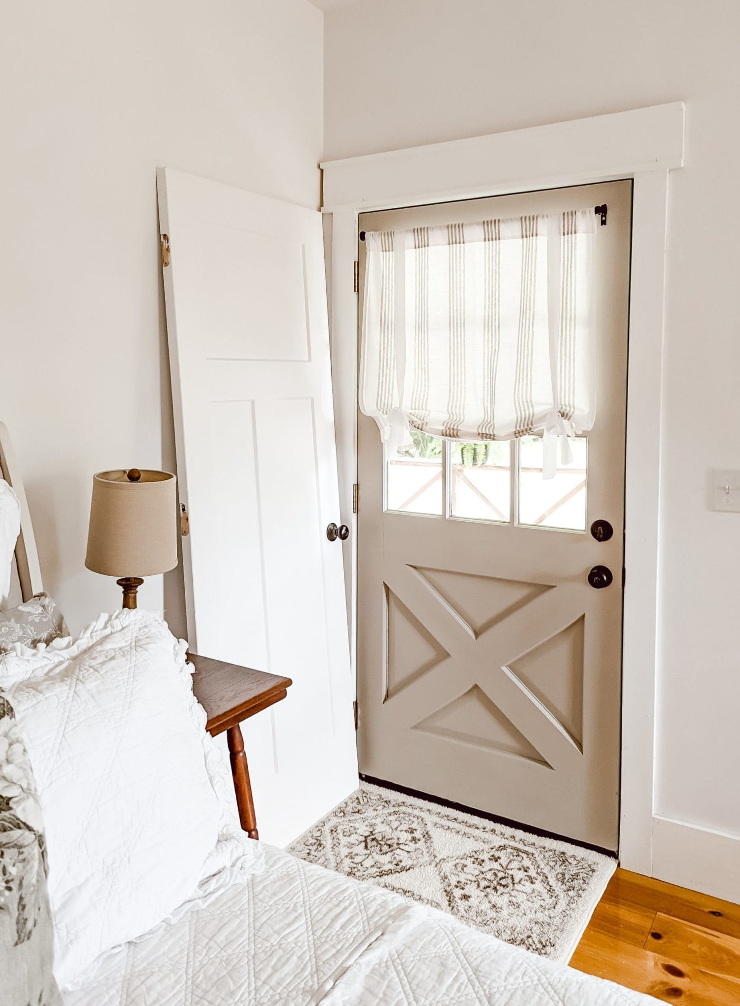 bathroom door off the hinges and leaning against the wall