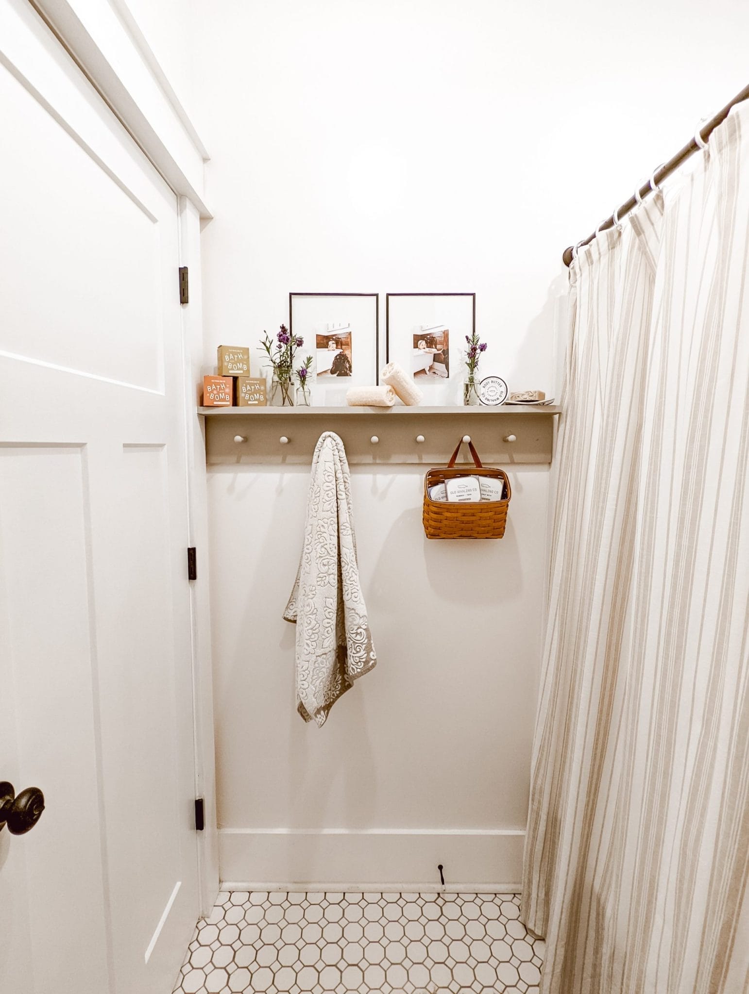 white bathroom with peg rail shelf