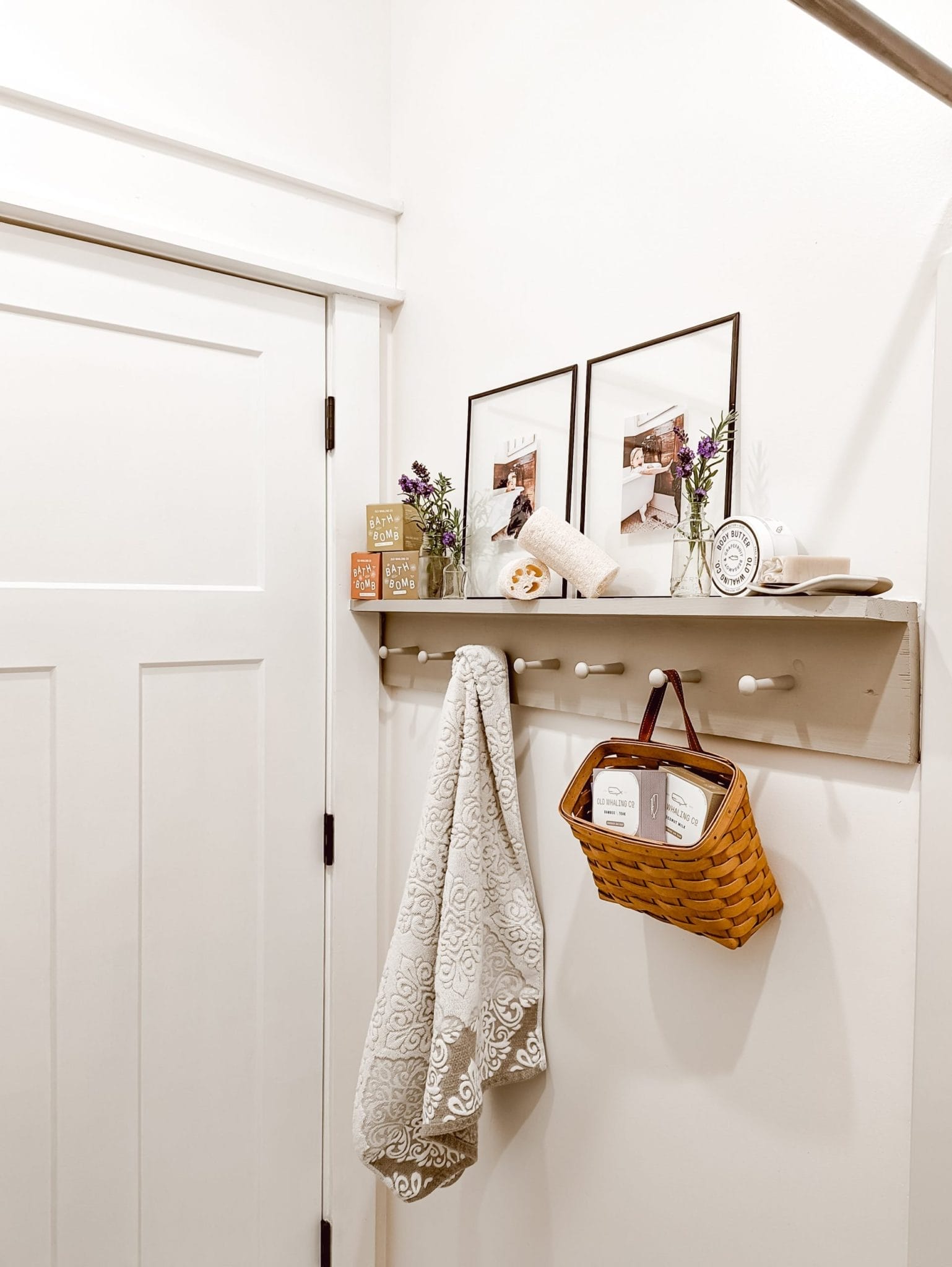 DIY wooden peg rail shelf in white cottage bathroom
