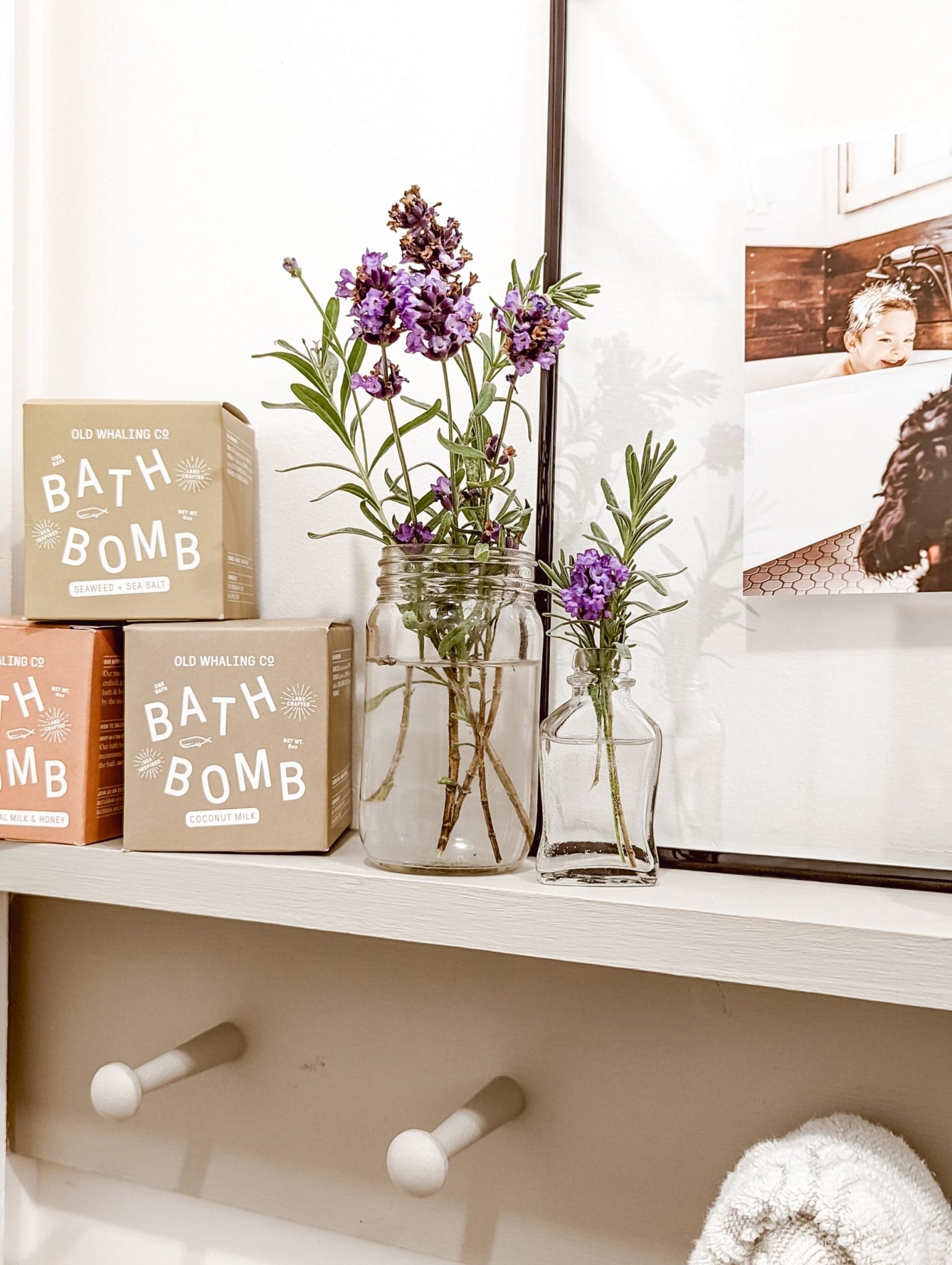 old whaling co bath bombs and fresh lanvender in glass jars on peg rail shelf
