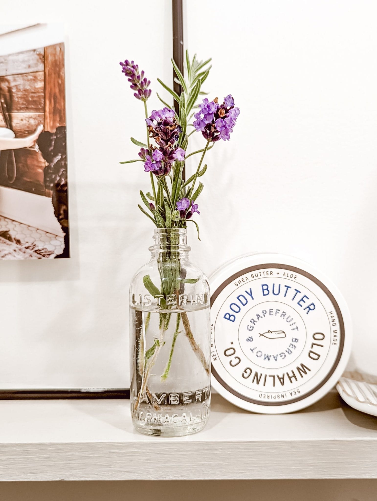 vintage glass Listerine bottle with fresh lavender sprigs