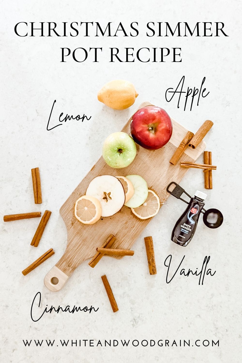 Christmas simmer pot recipe and ingredients arranges on wooden cutting board with apples, lemon, cinnamon sticks, and vanilla