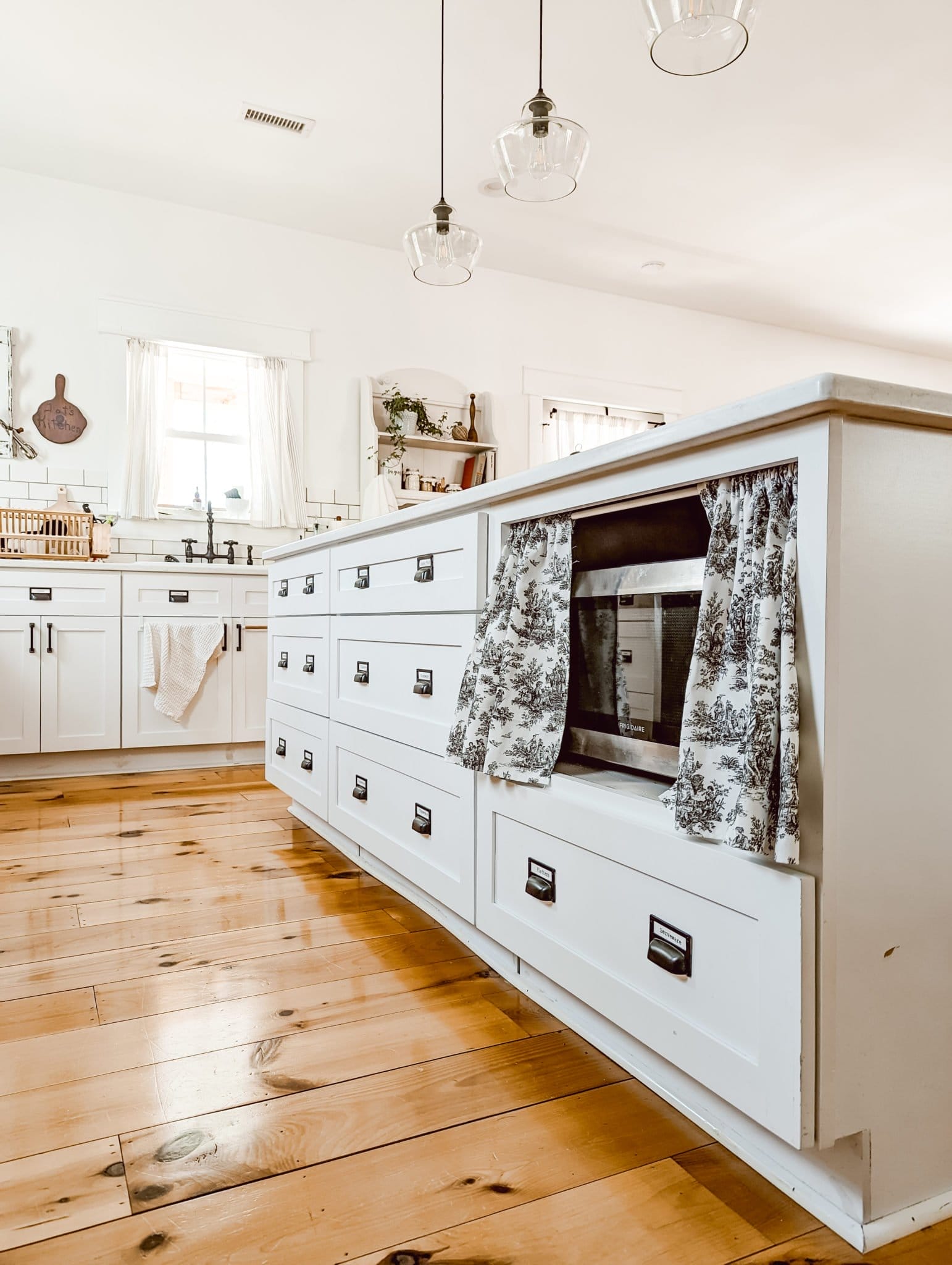 DIY kitchen cabinet curtains for a microwave cabinet