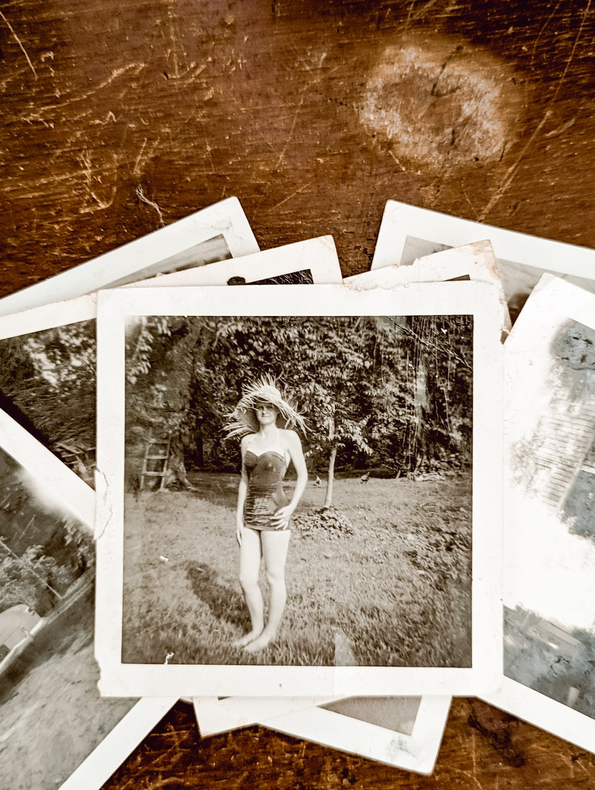 black and white photo from the 1950's of a girl in a bathing suit and sun hat