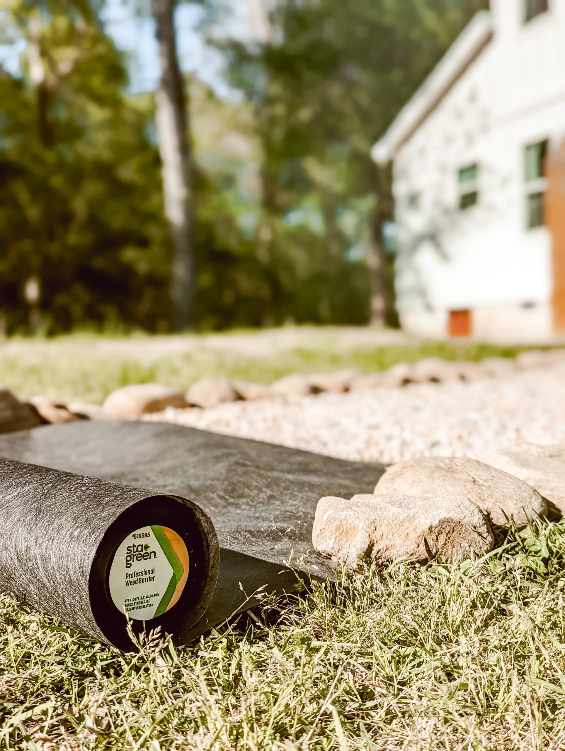 DIY cottage garden path with pea gravel and a natural stone border edging