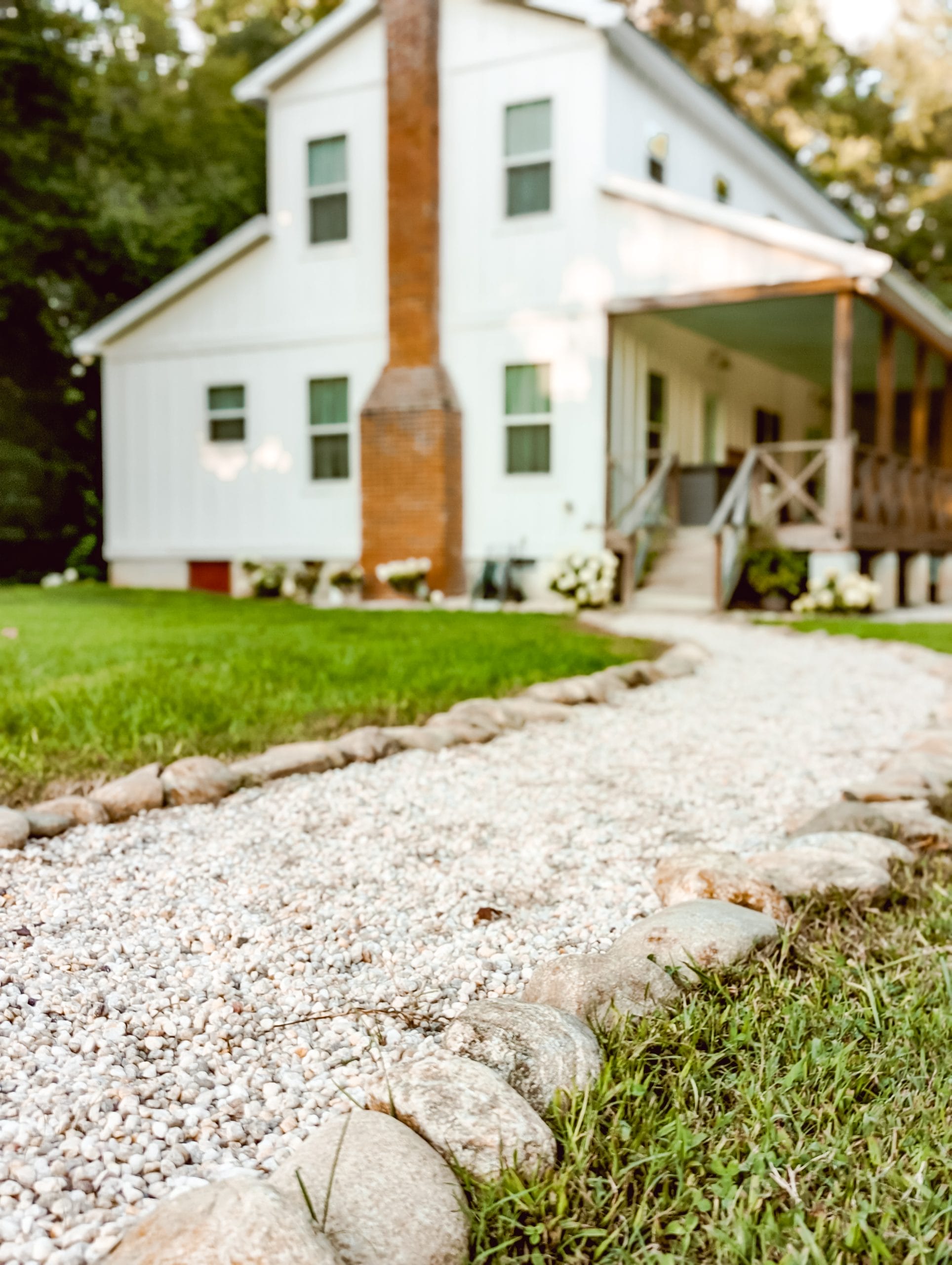 pea gravel with a natural stone edging in a country farmhouse walkway