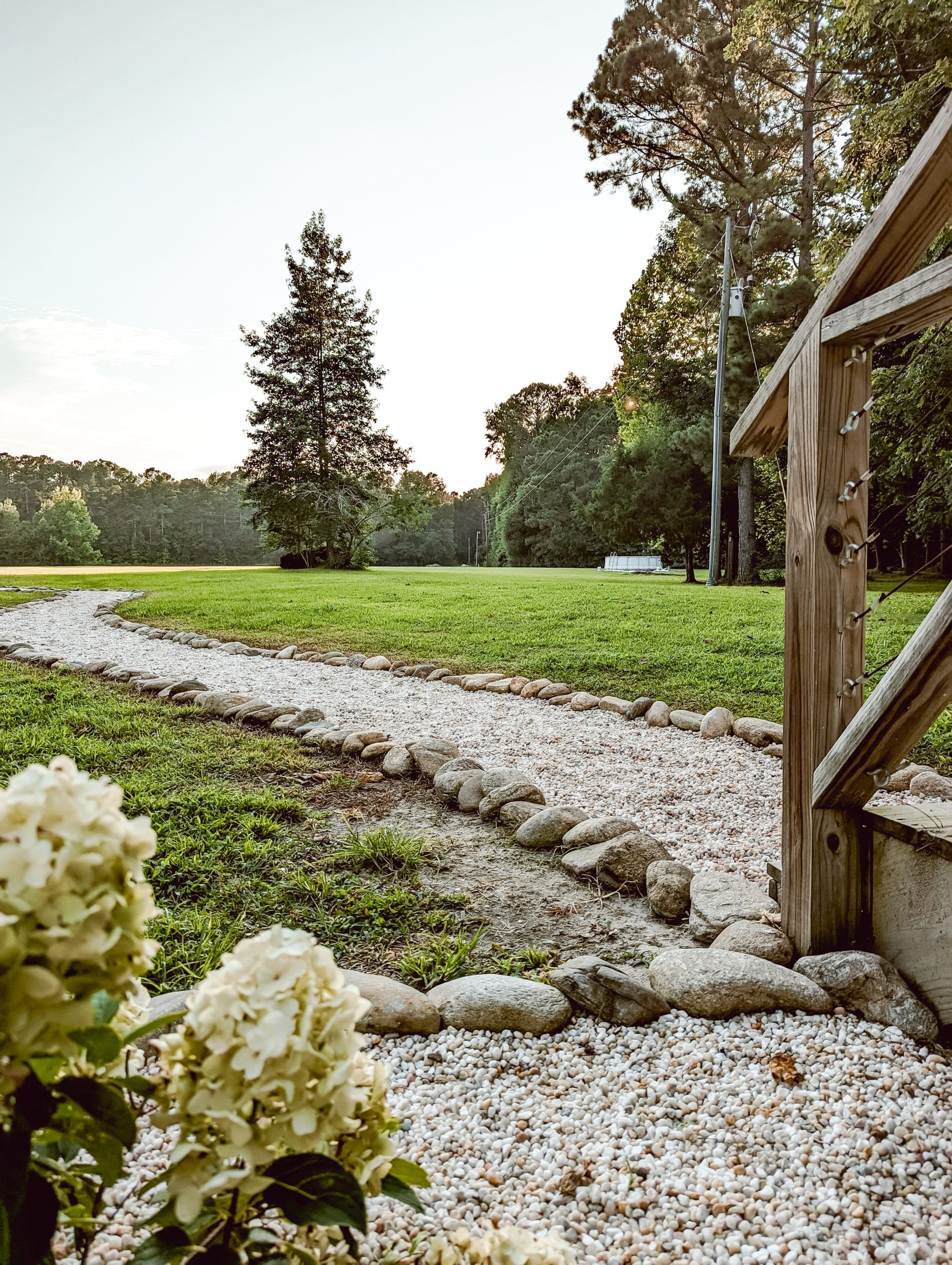 pea gravel walkway in a country farmhouse style landscaping
