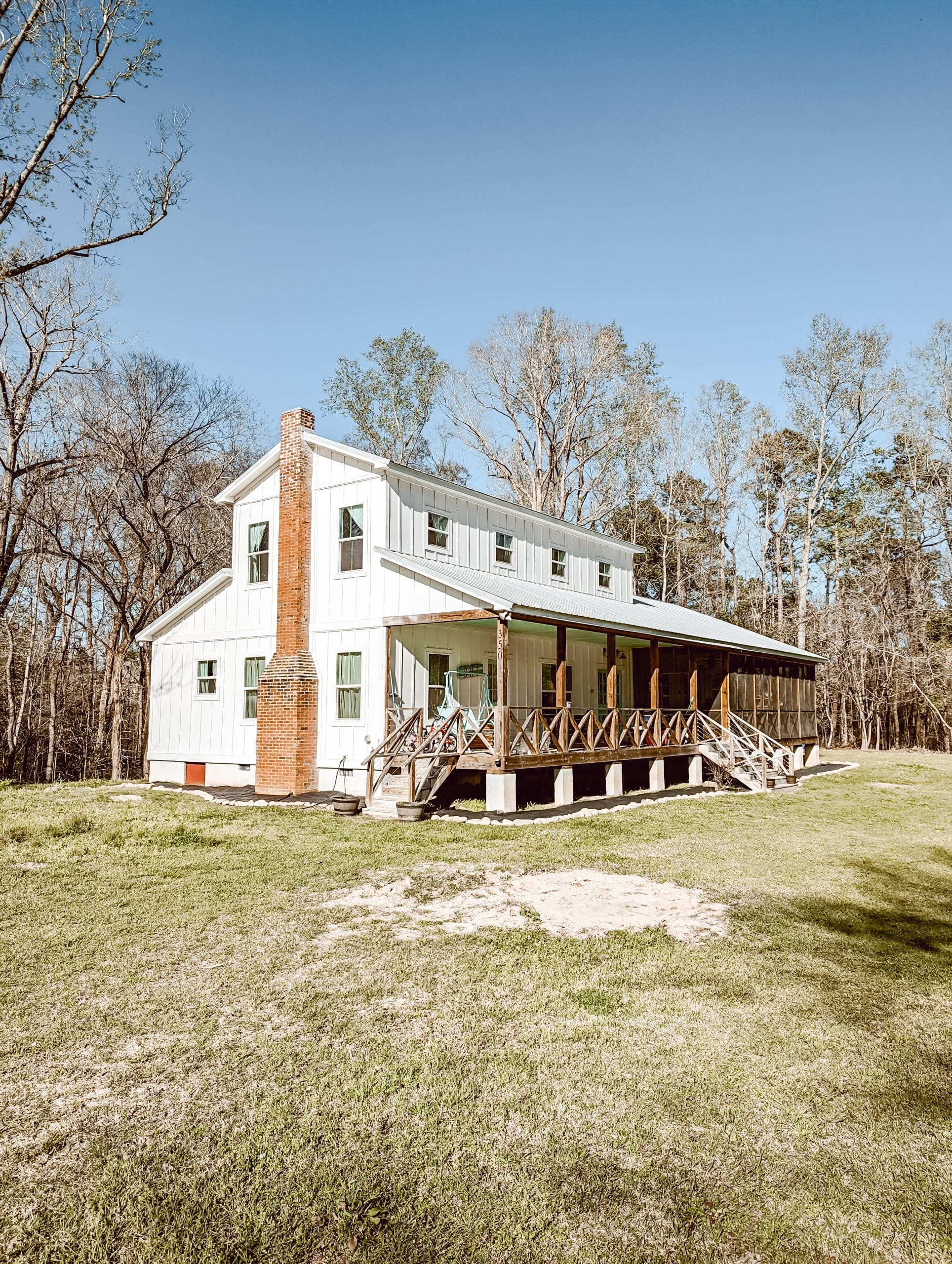 1800's 2 story farmhouse in North Carolina with white board and batten siding