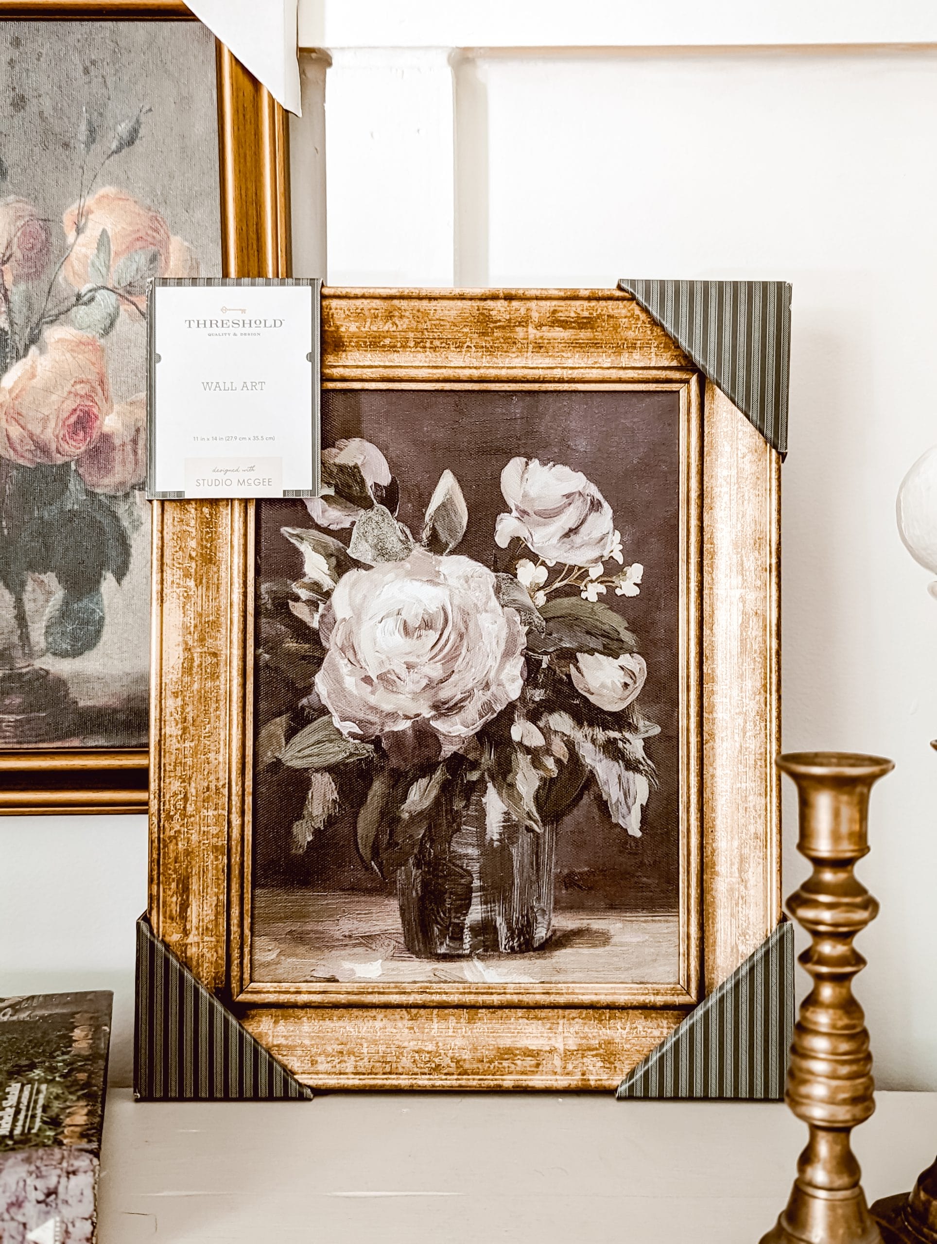 thrifted vintage style floral art in a gold frame