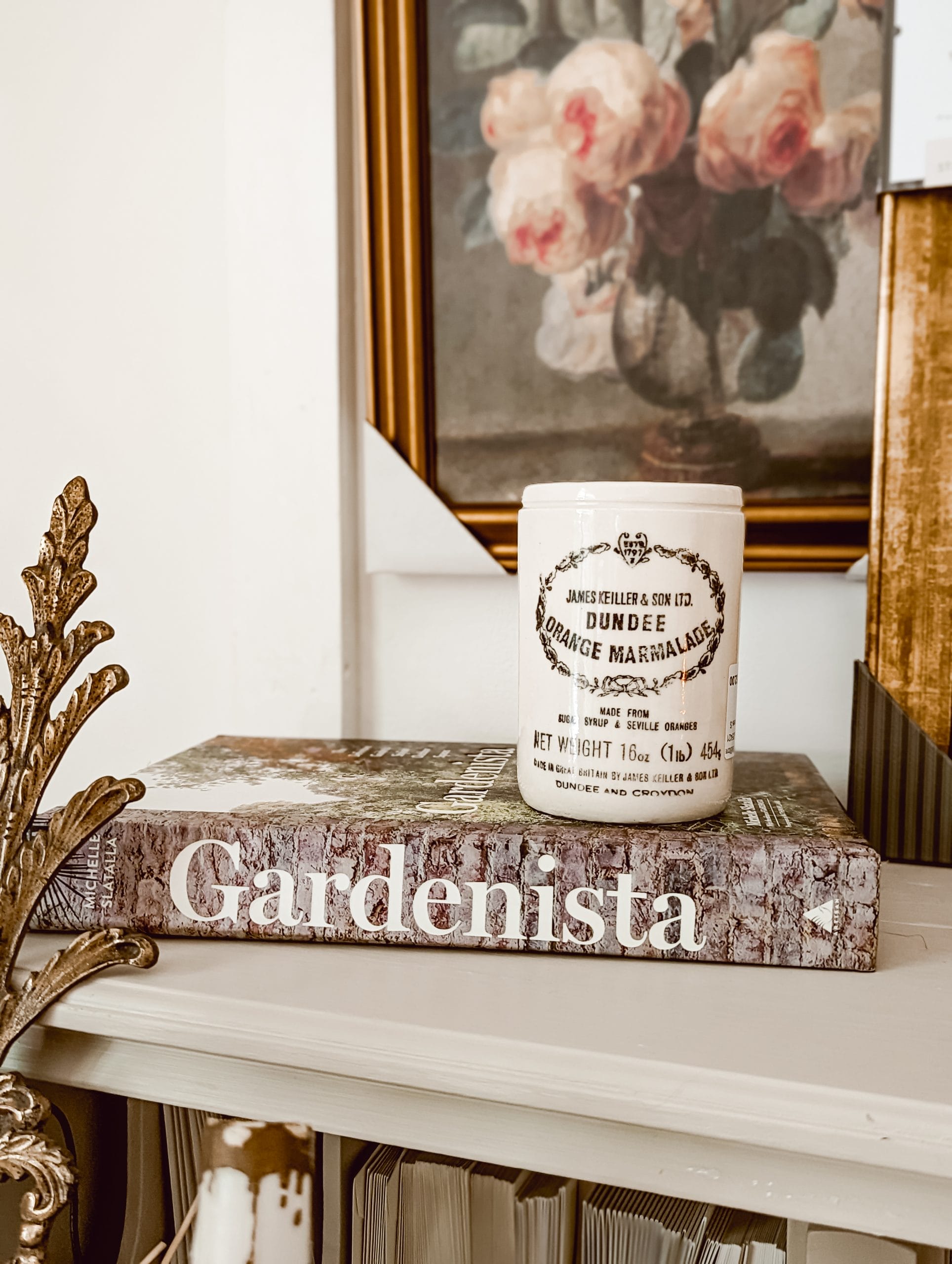 thrifted gardenista book with a vintage dundee orange marmolade crock on top