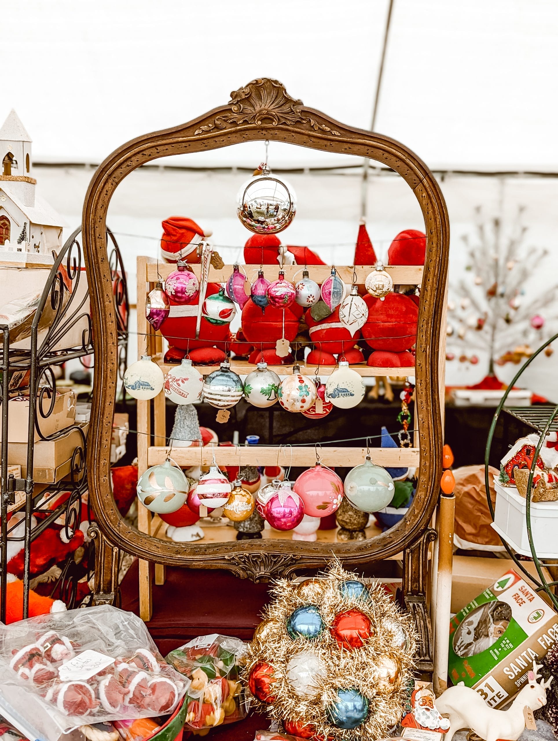vintage Christmas ornament display on a vintage frame at the Liberty Antique Festival