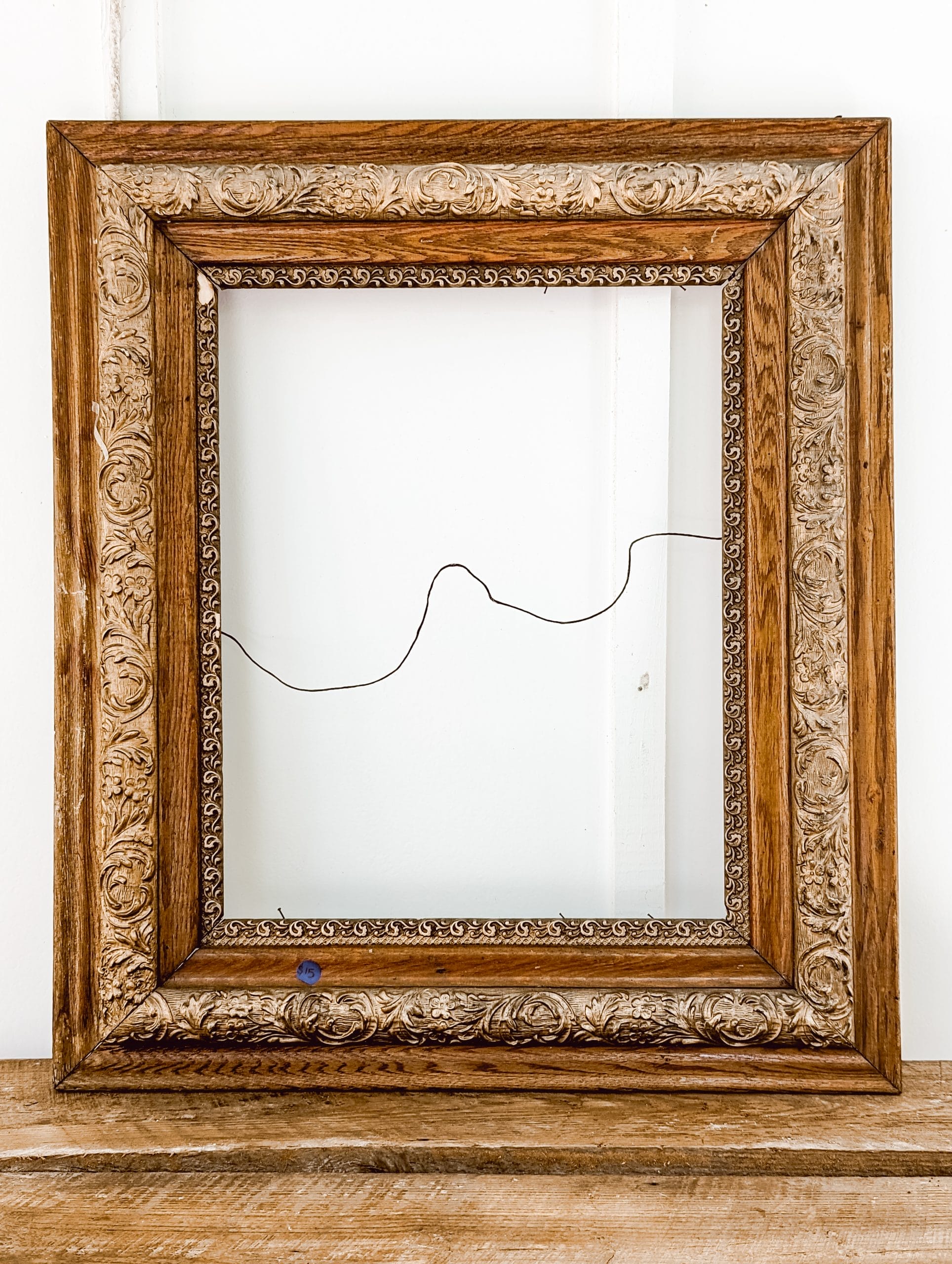 antique wood frame with gold trim detail