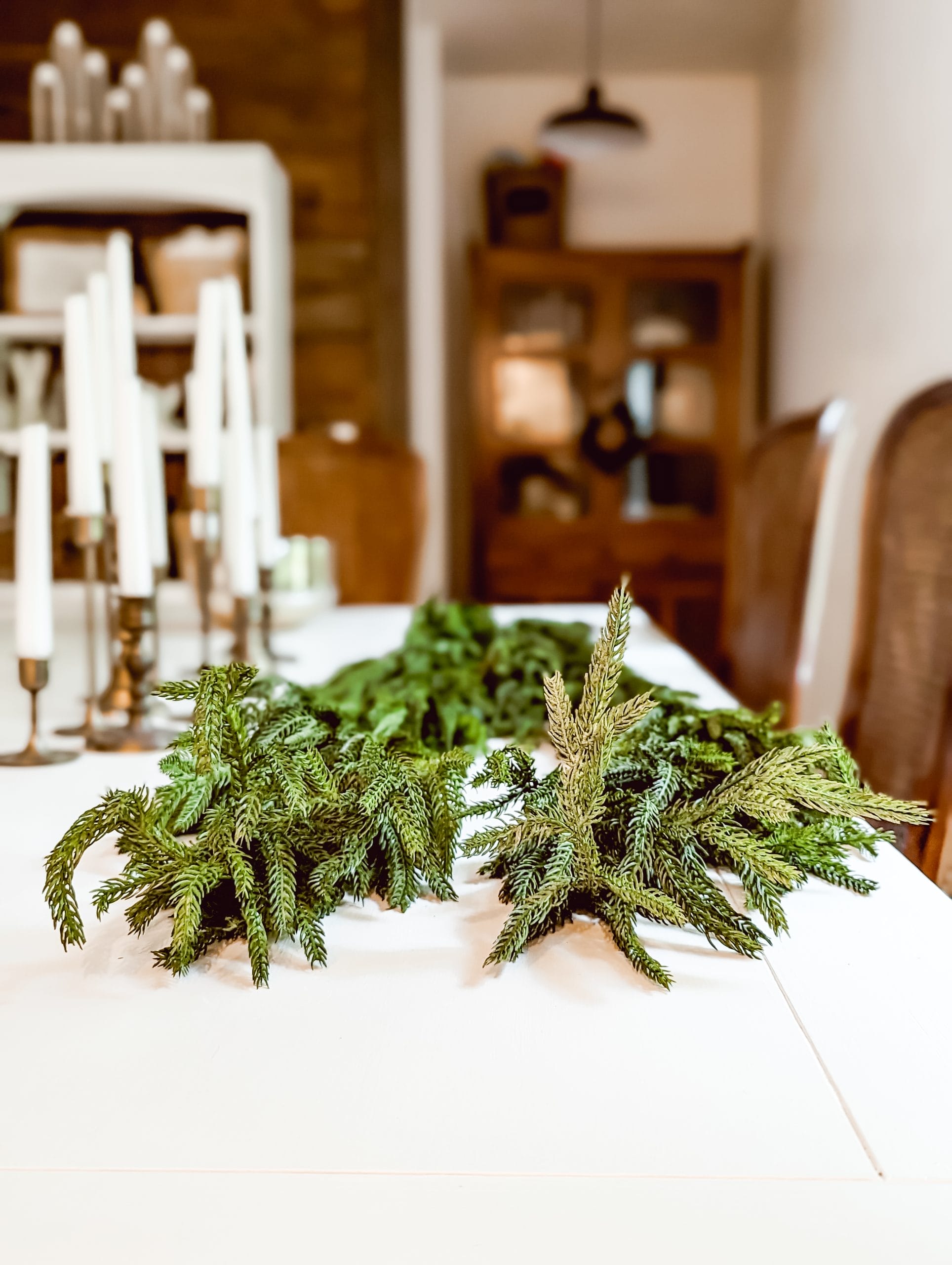 5 foot pine garlands running down the center of a dining table