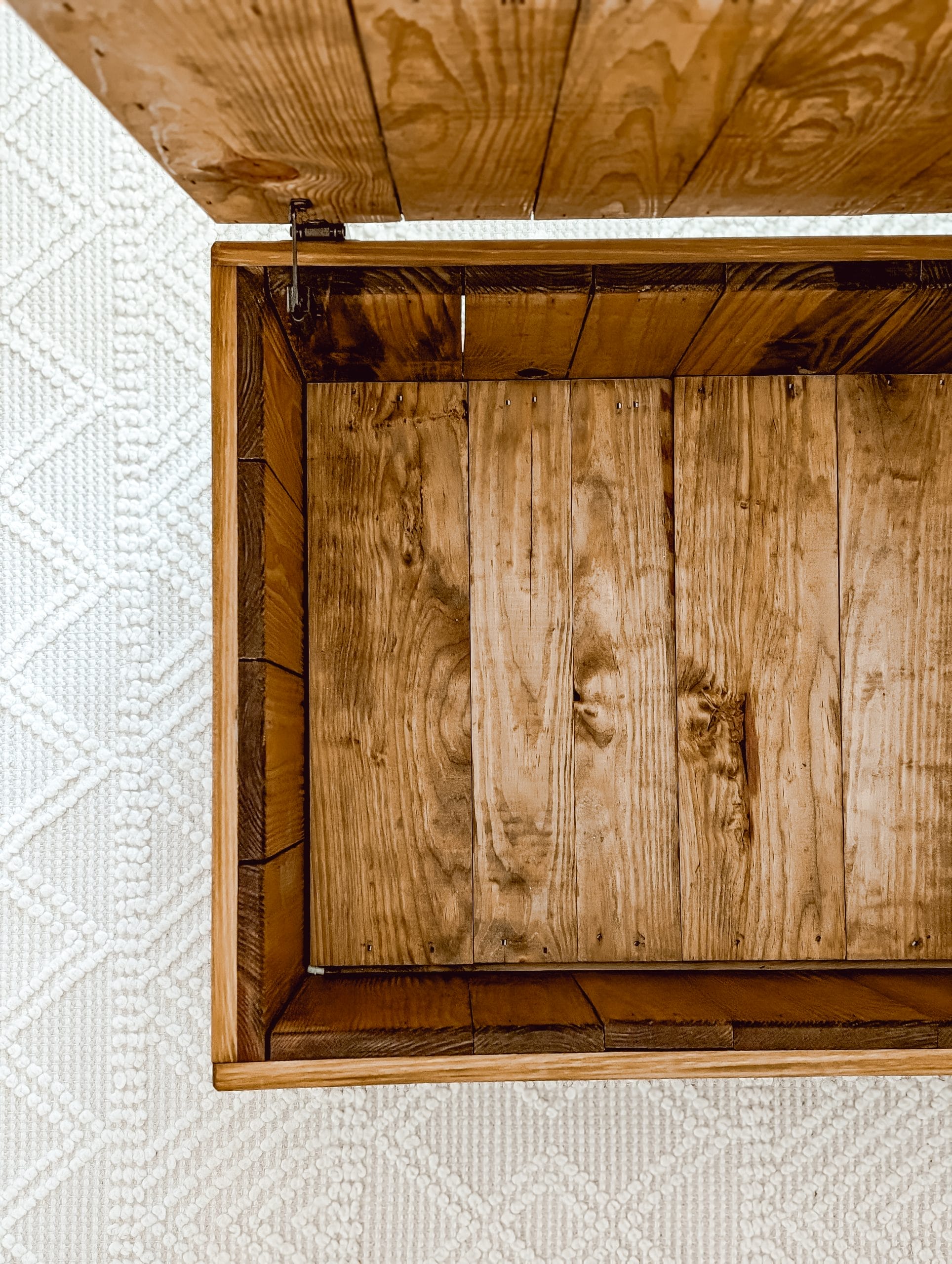 inside of a vintage "This End Up" pine wood toy chest