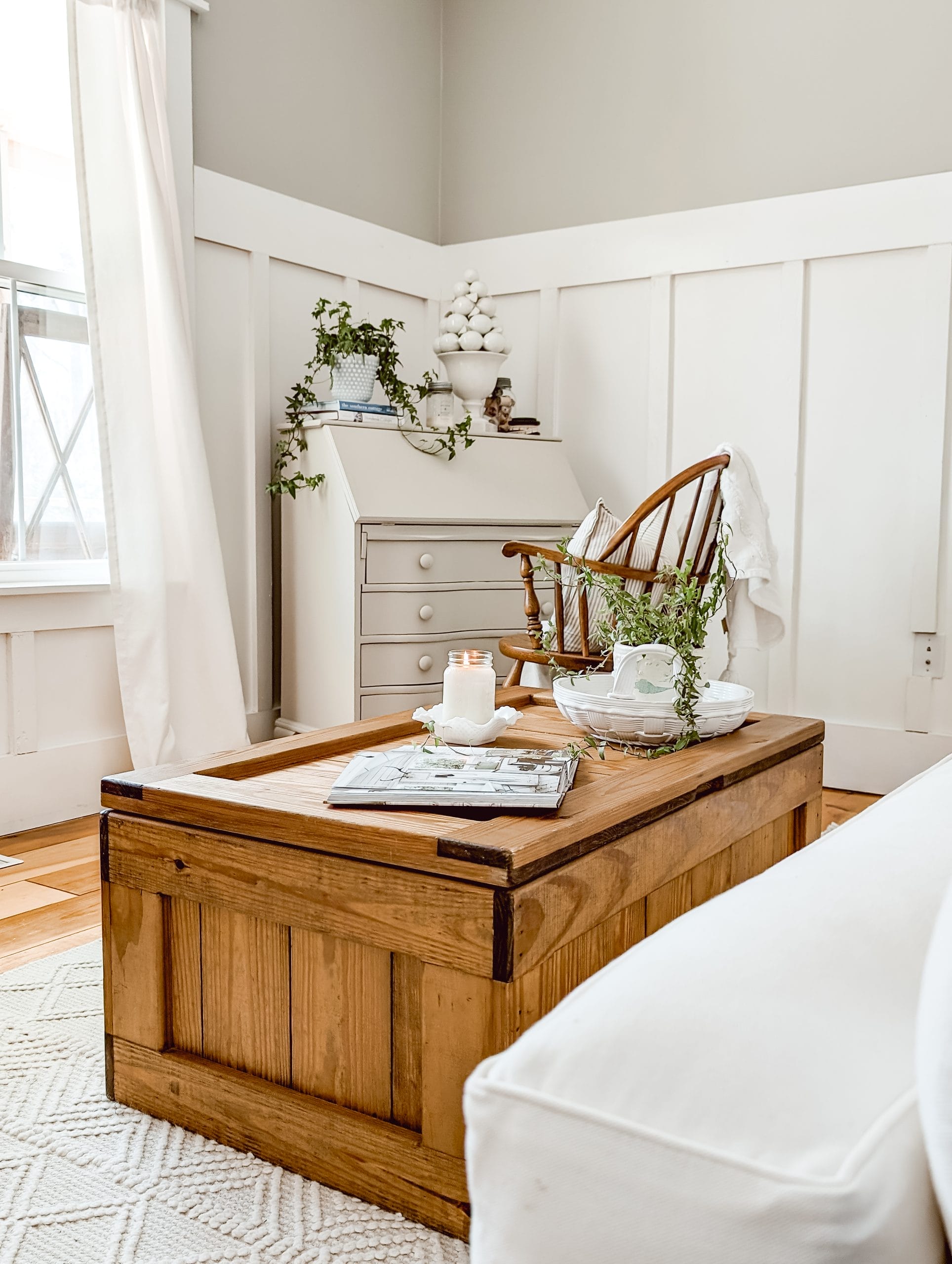 vintage pine wood chest that serves as a coffee table in a sitting room