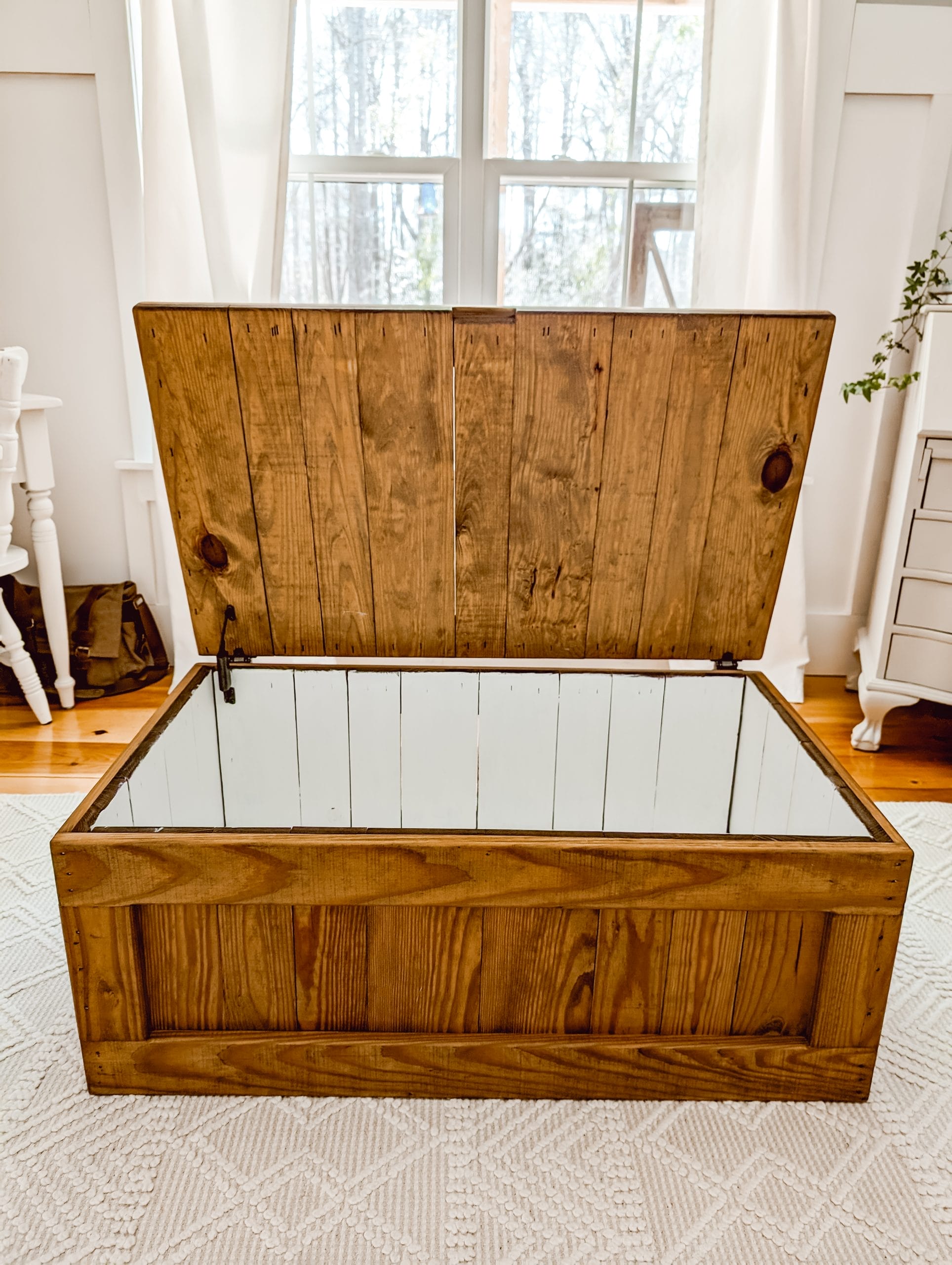 thrifted "this end up" toy chest after painting the interior white