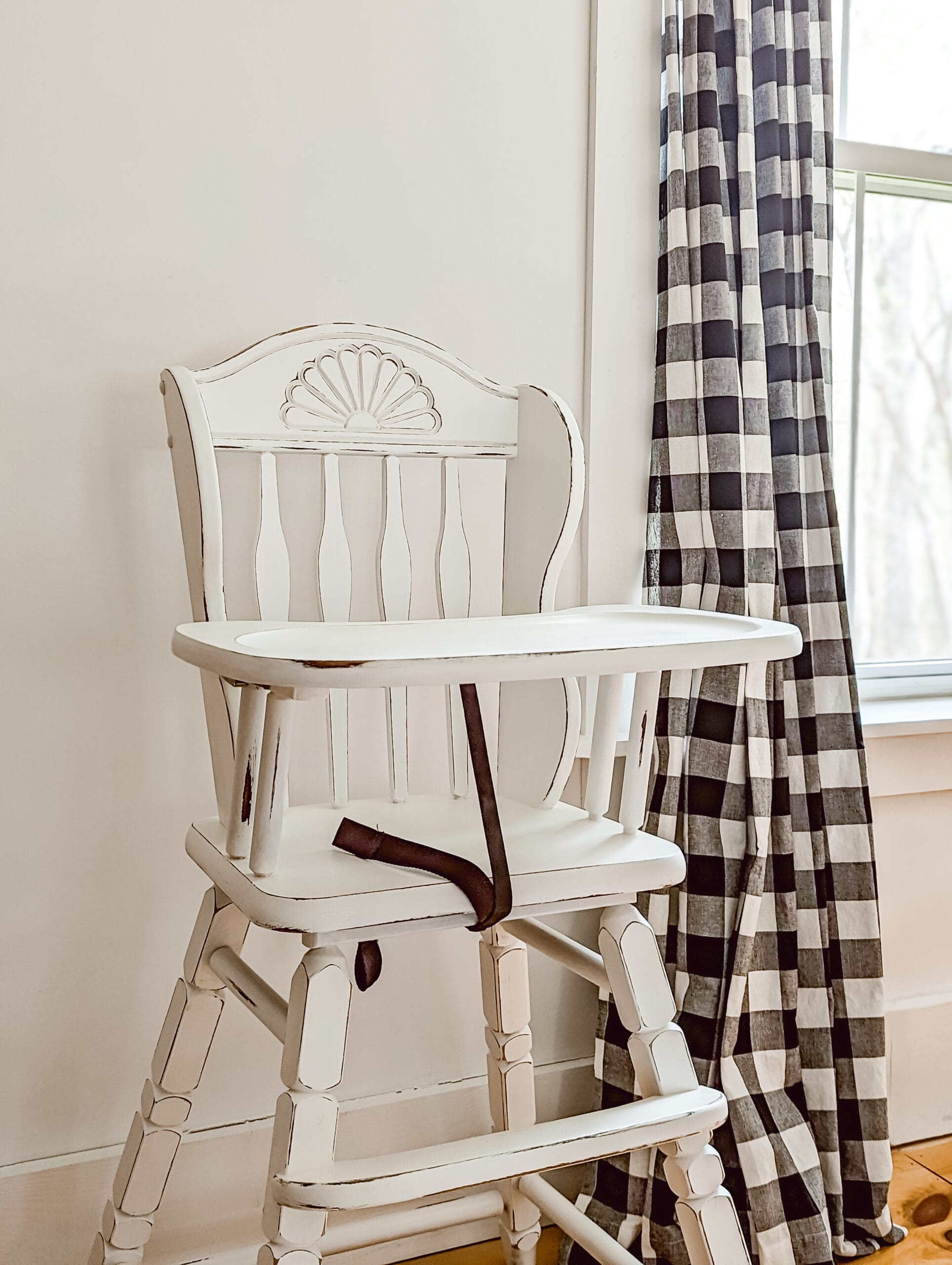 vintage high chair painted white in the color picket fence by Fusion Mineral Paint