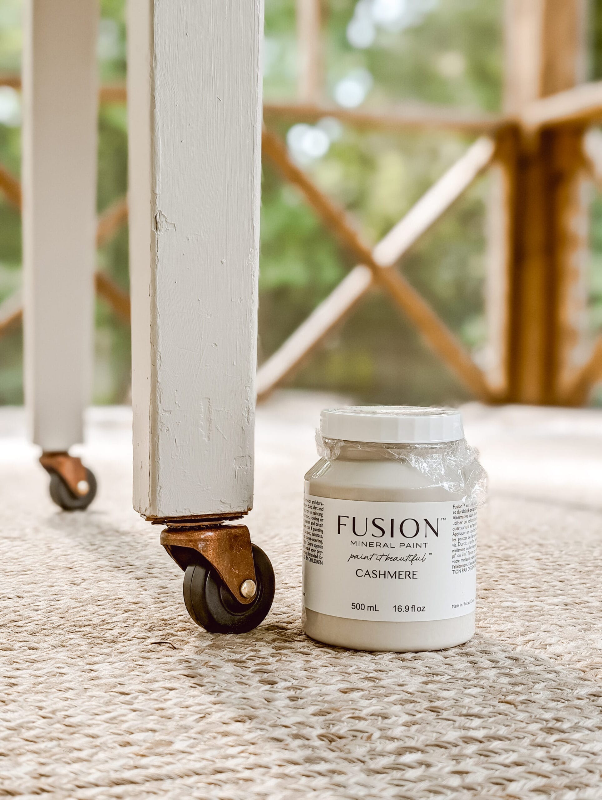 pint of Cashmere by Fusion Mineral Paint next to a painted table leg