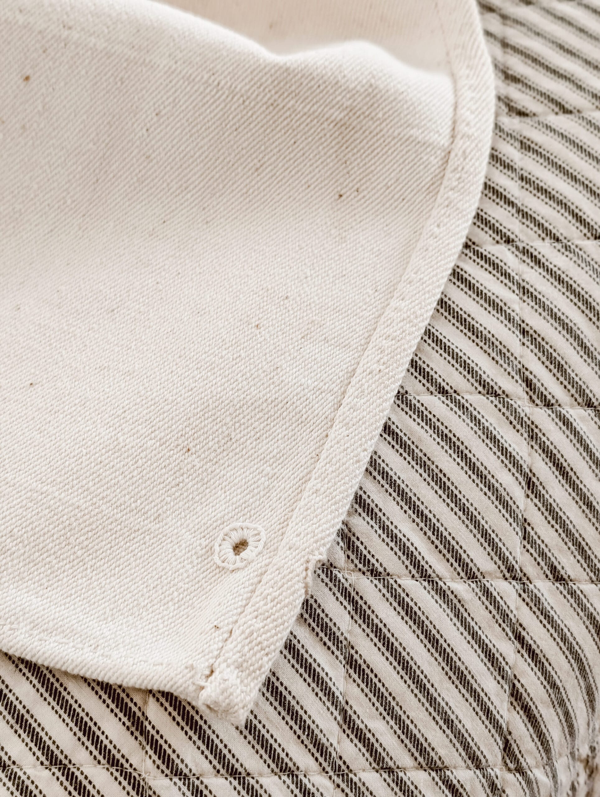 close up detail of the seams on an antique grain sack