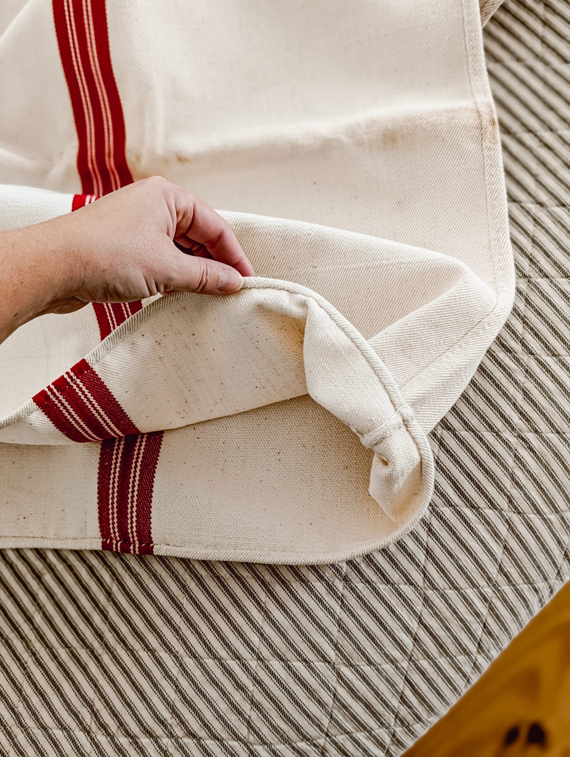 opening of an antique red and white grain sack