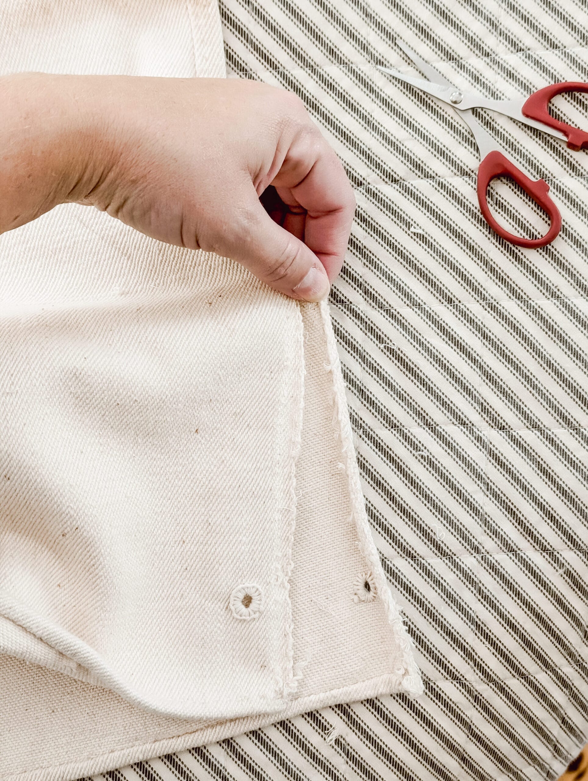 opening up the seams of an antique grain sack