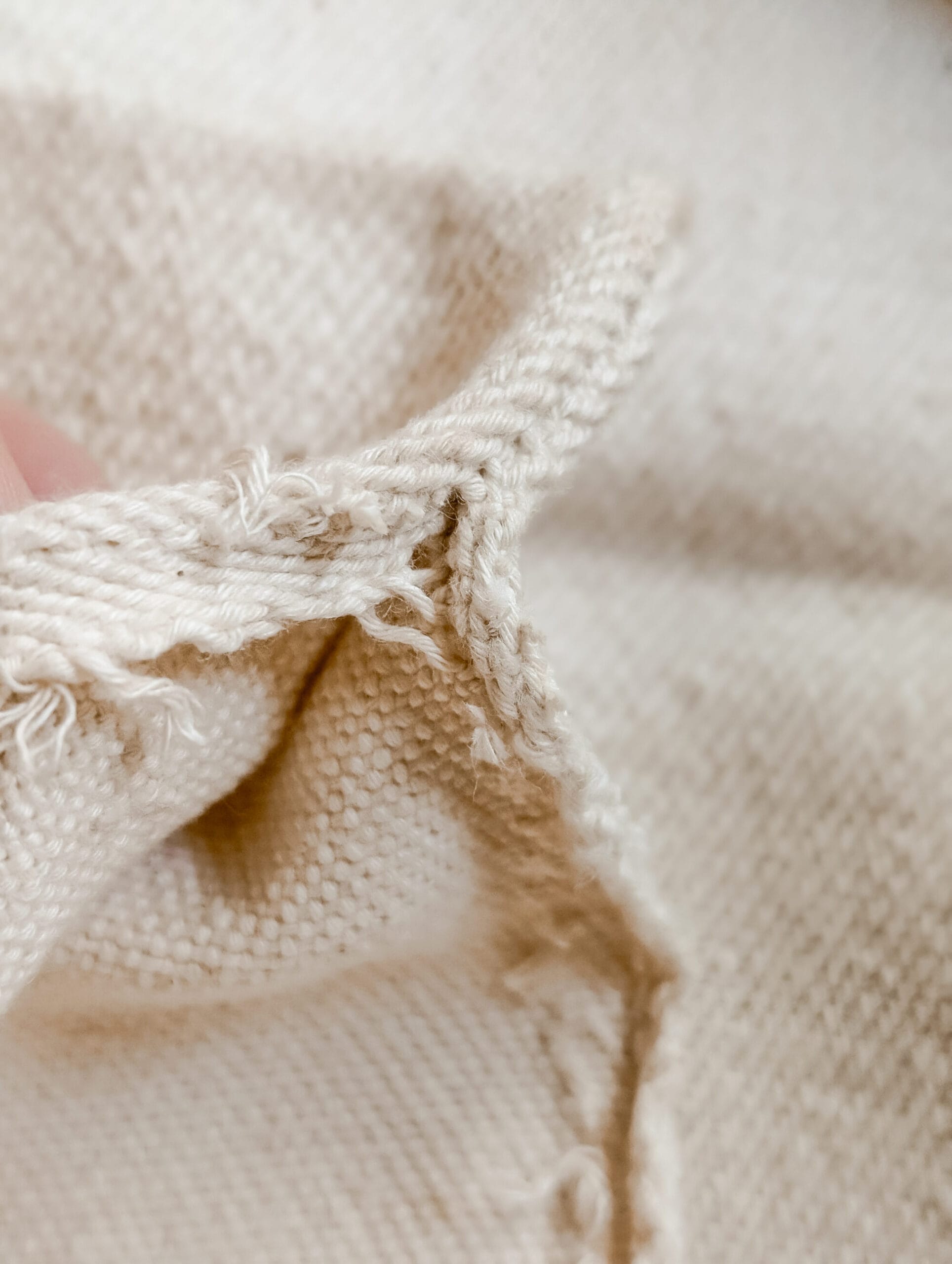 opening up the seams of an antique grain sack