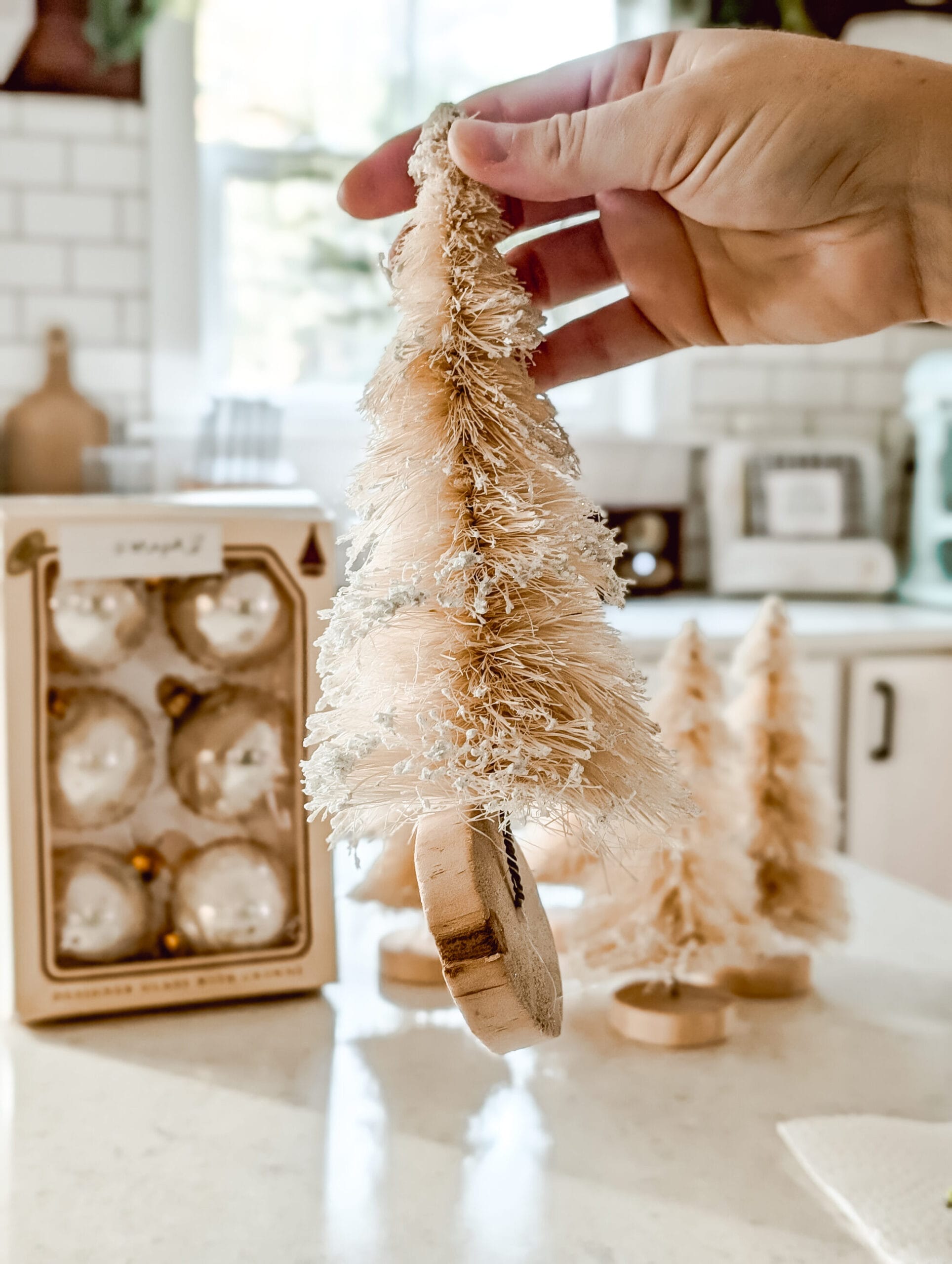 bending the wire of the bottle brush trees flat