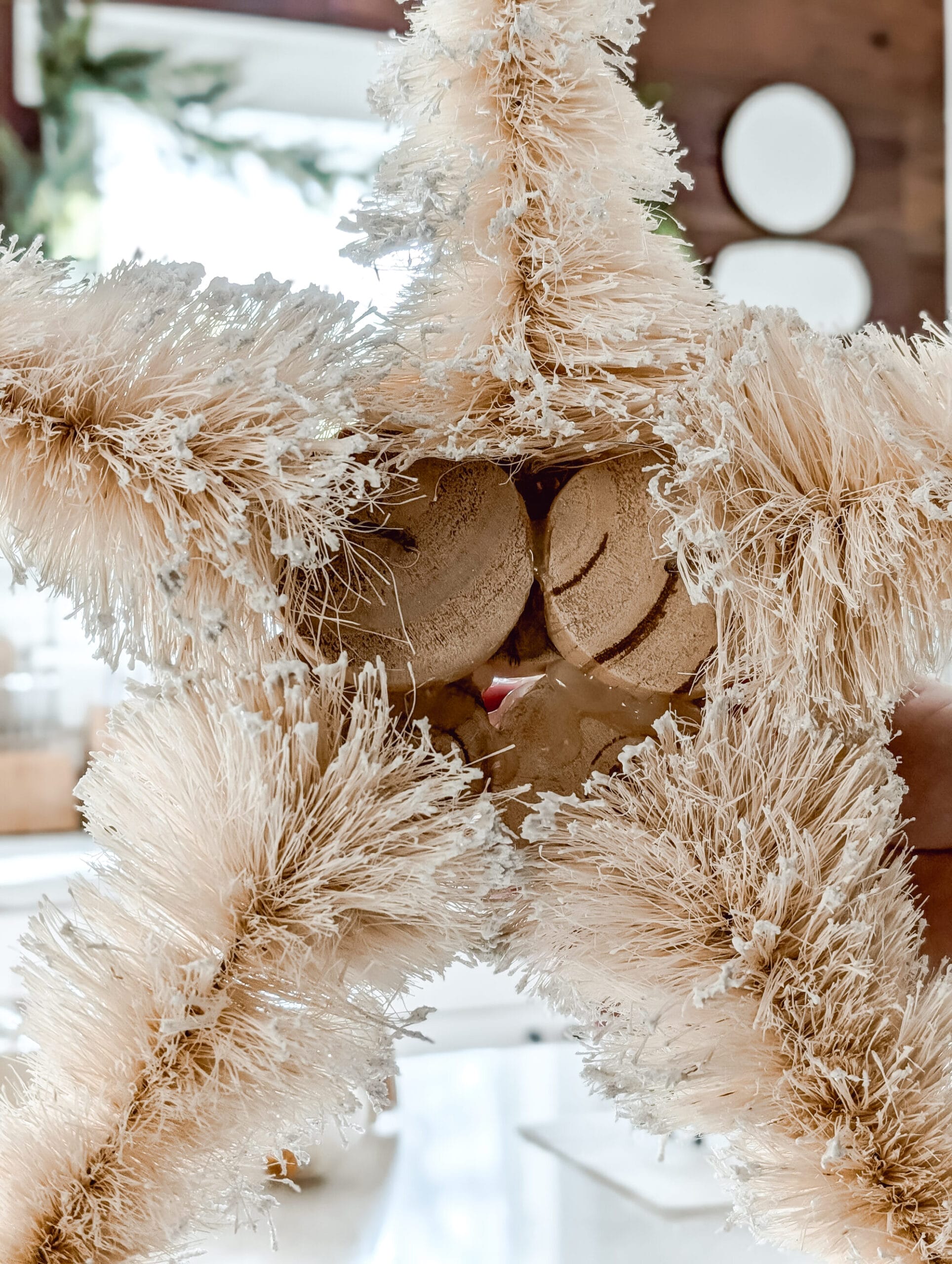 hot glueing the wood bases of the bottle brush trees together